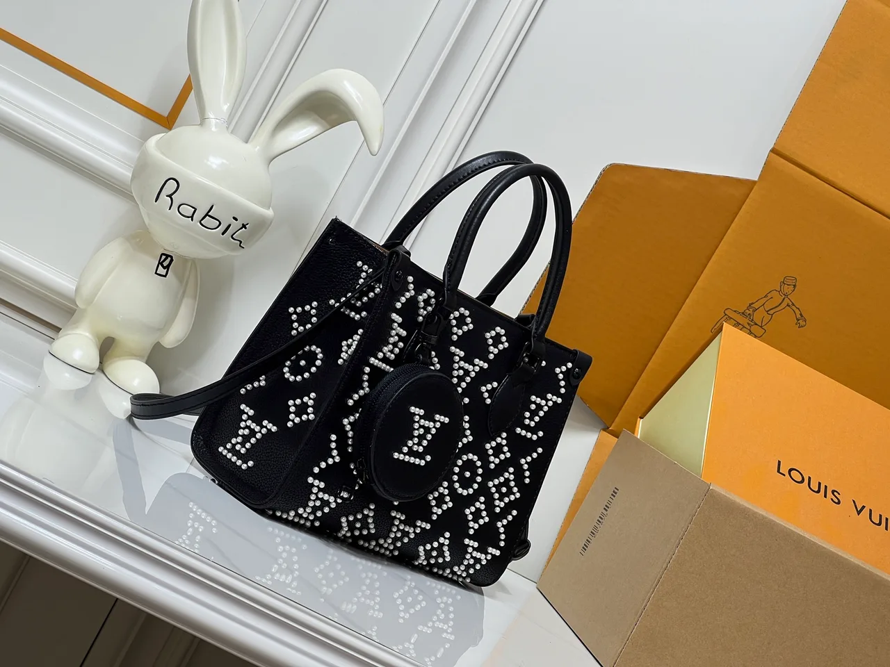 Louis Vuitton Cowhide OnTheGo Tote in Black · view 1