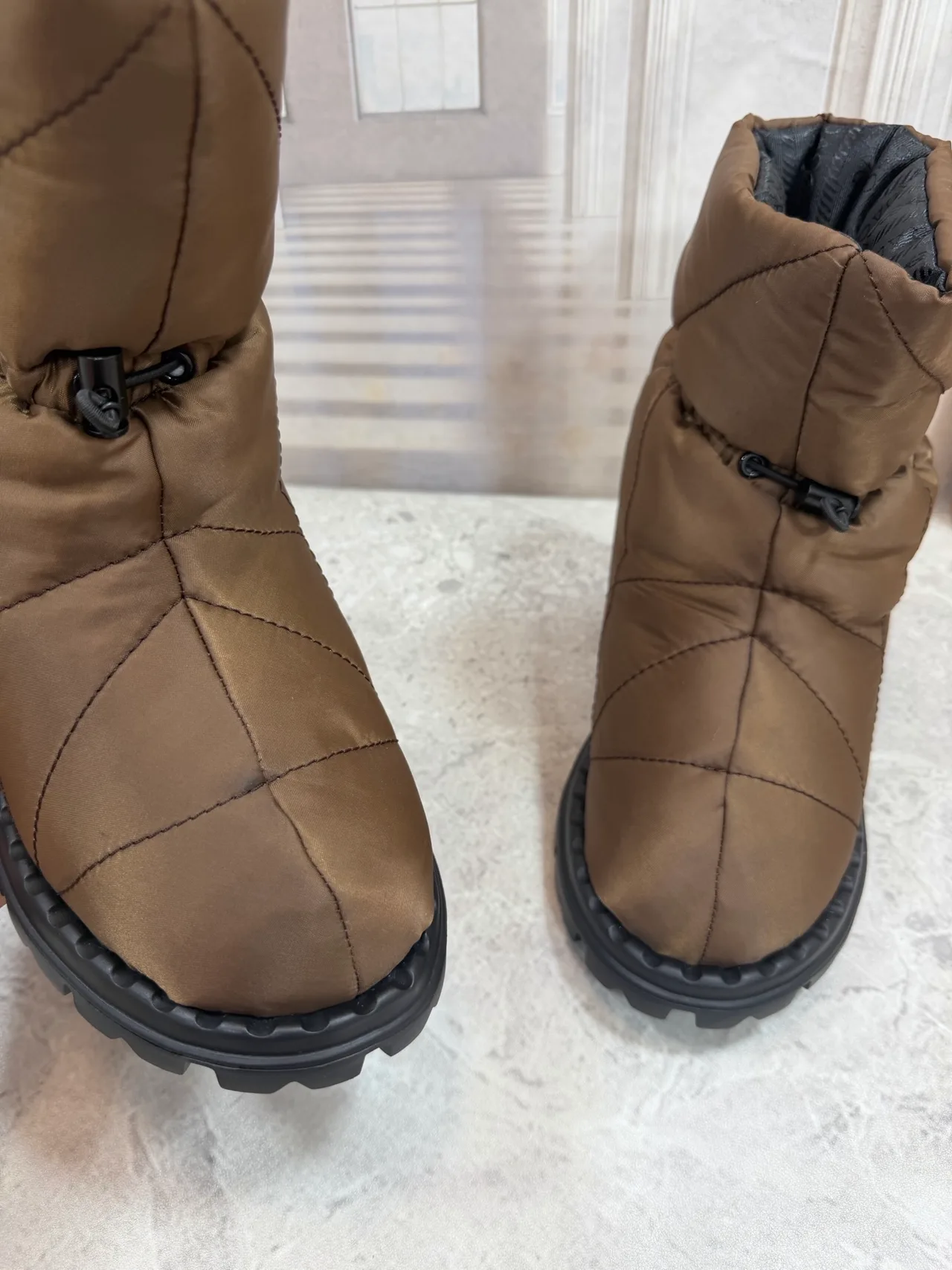 Prada Quilted Round-Toe Puffer Boots in Brown · view 7