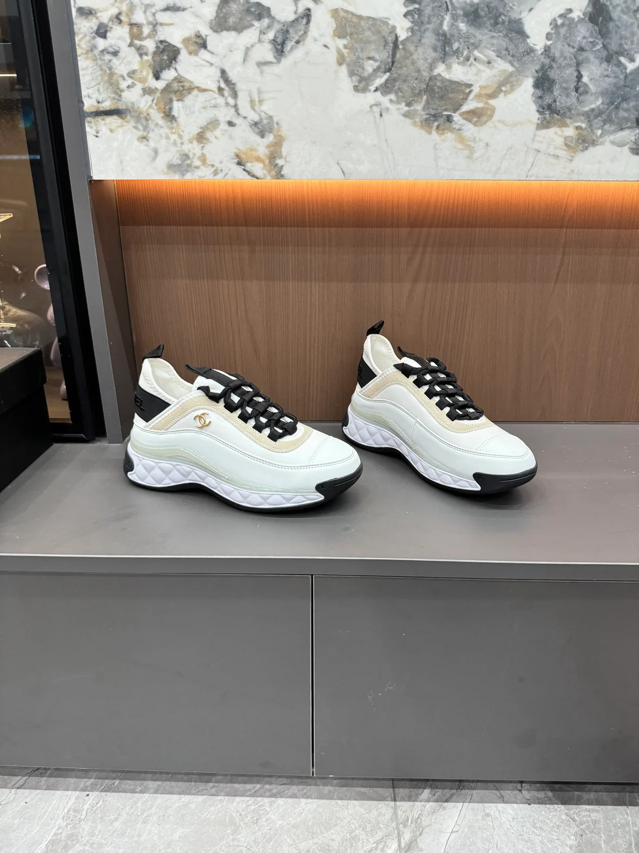 Chanel Cowhide Quilted Lace-Up Sneakers in White · view 3