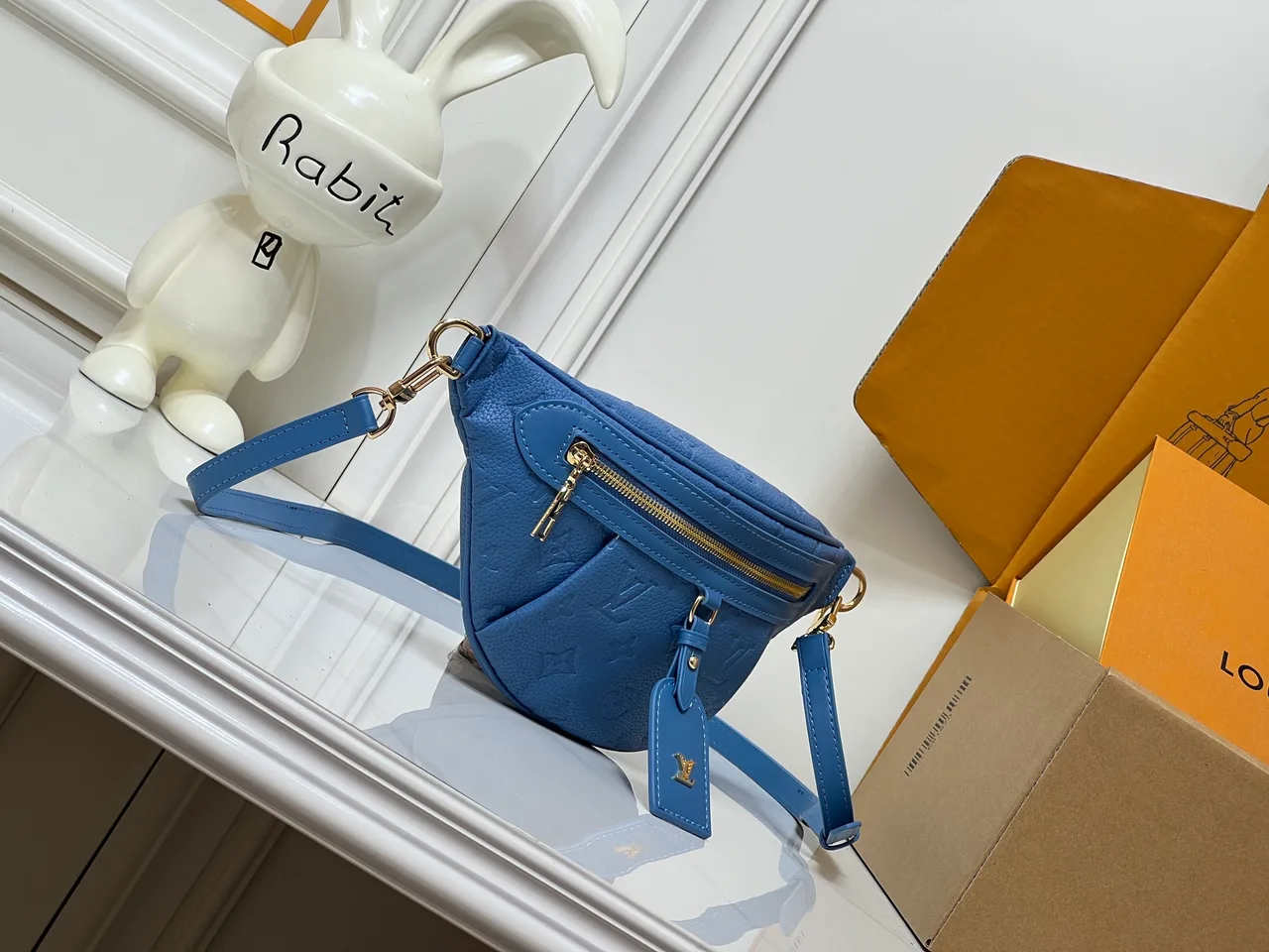 Louis Vuitton Leather Embossed Belt Bag in Blue · view 1