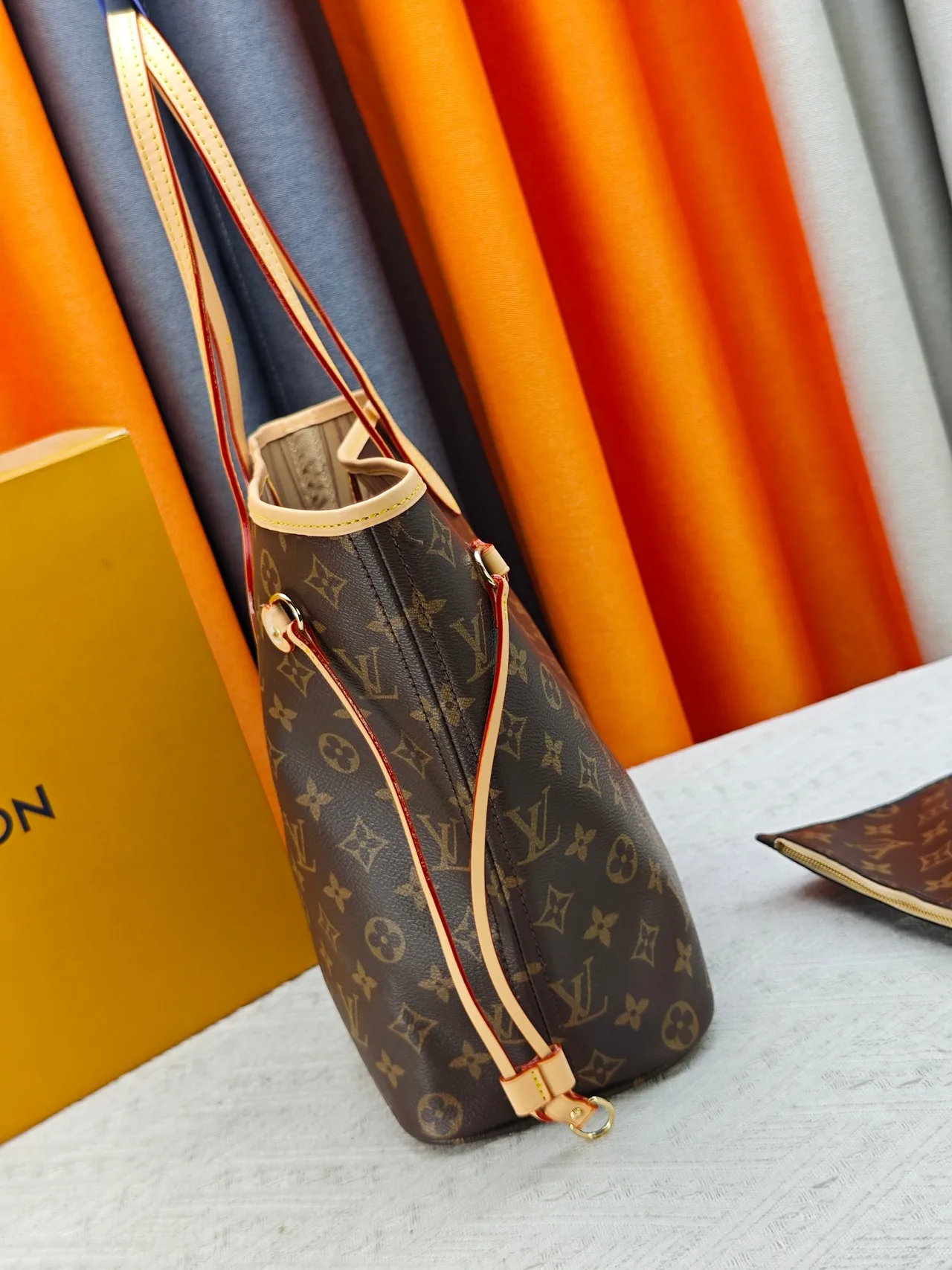 Louis Vuitton Neverfull Clutch in Brown · view 4