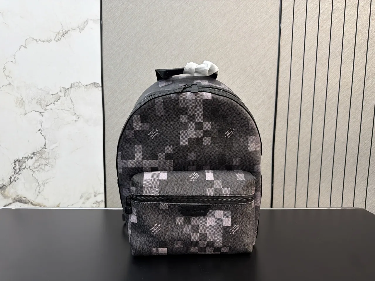 Louis Vuitton Backpack in Grey · view 1