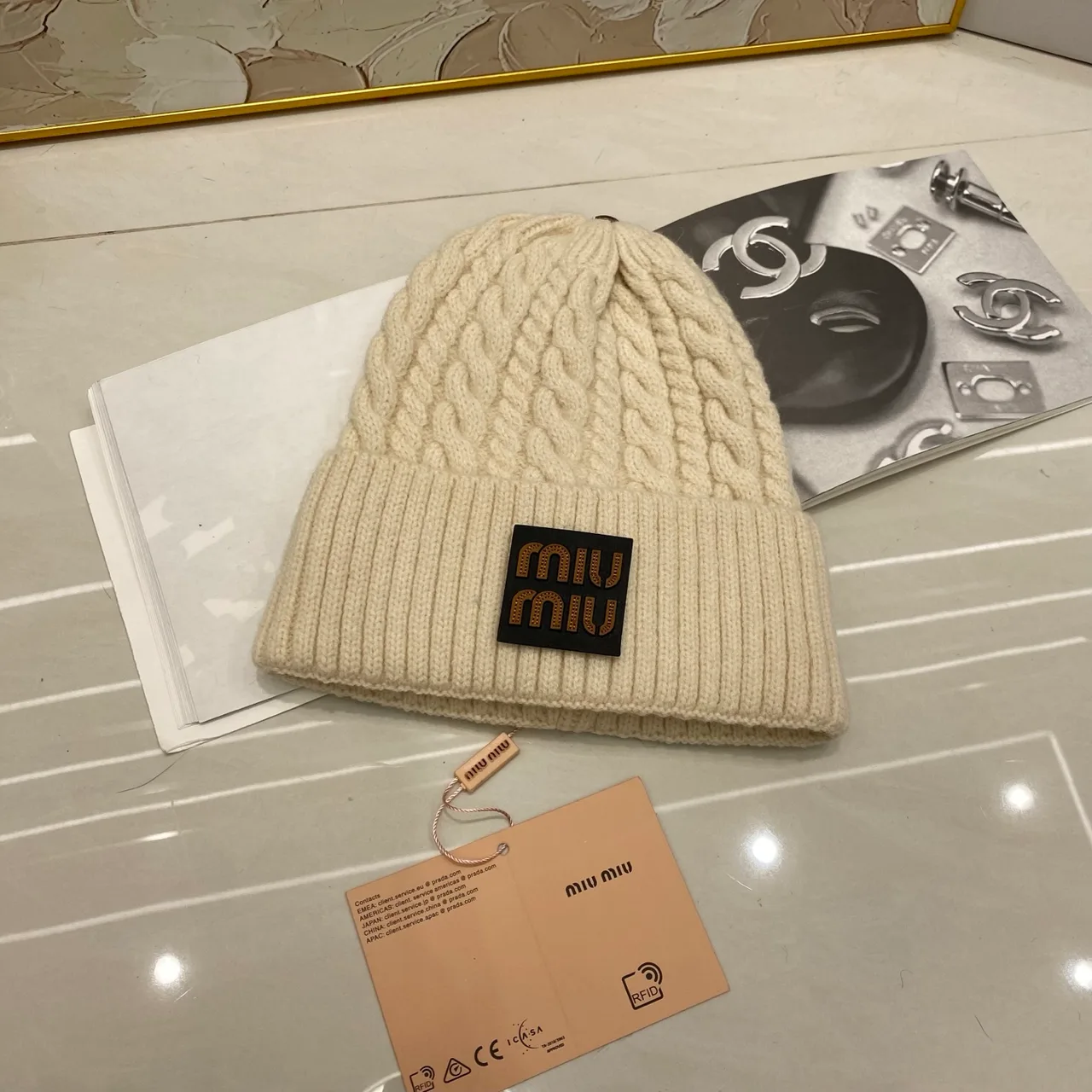 Miu Miu Cable-knit logo beanie in Black & White & Grey & Tan & Cream & Burgundy & Brown · view 5