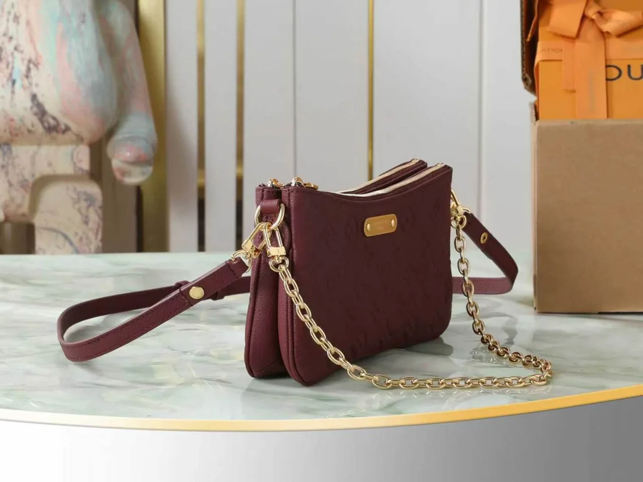 Louis Vuitton Leather Quilted Clutch in Burgundy · view 2