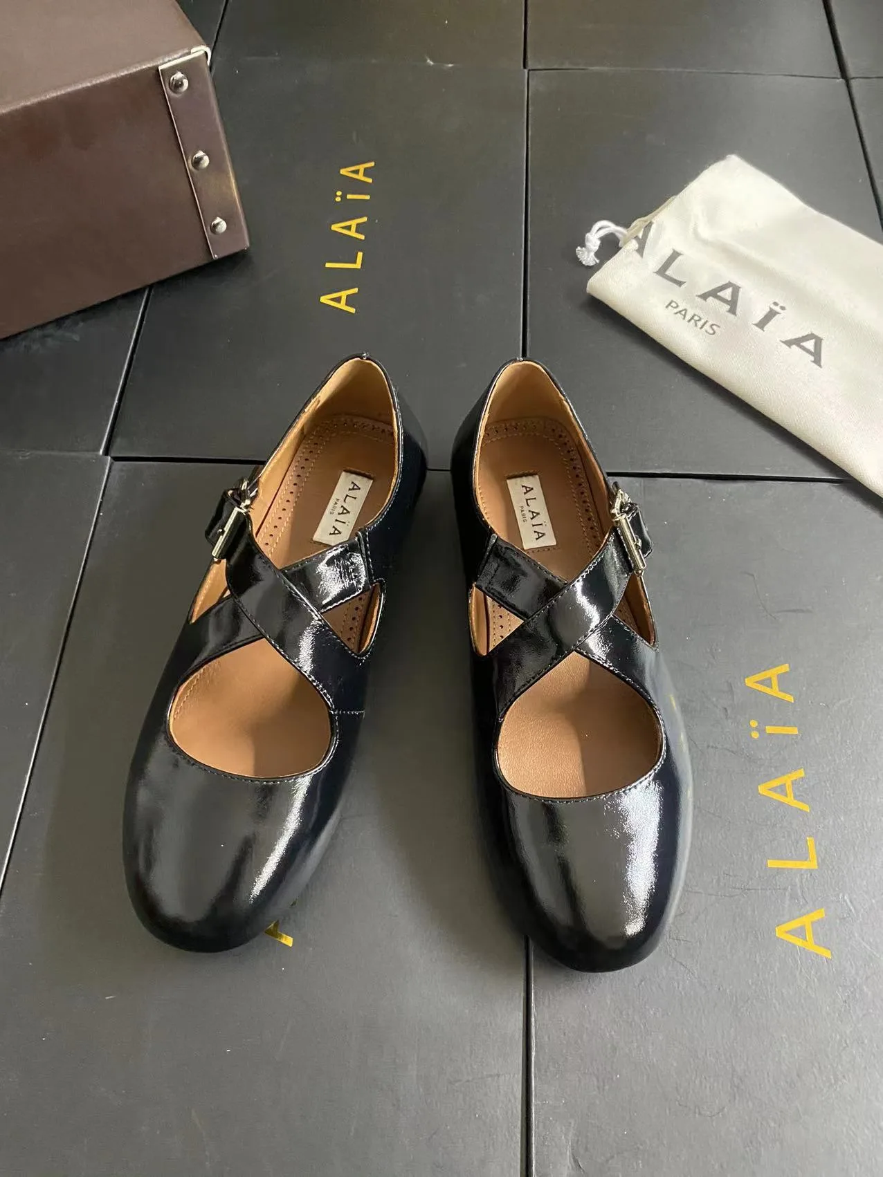 Alaia Cowhide Sheepskin Glossy Square-Toe Buckle Cross-Strap Flats in Black · view 4