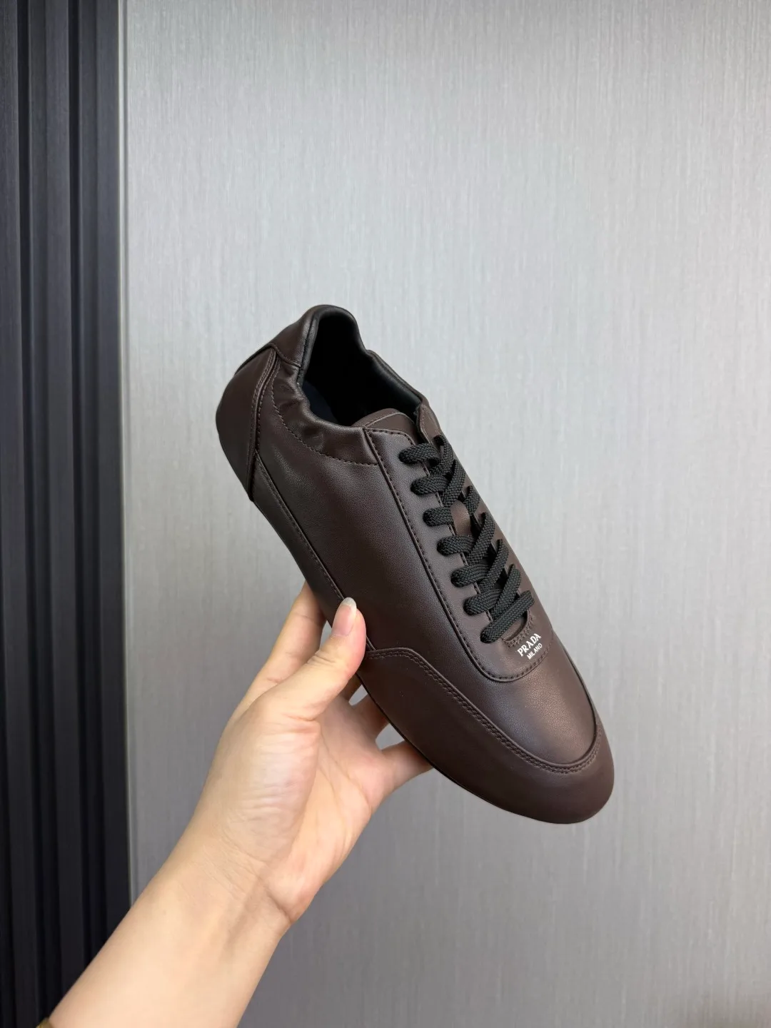 Prada Cowhide Quilted Round-Toe Sneakers in Brown · view 8
