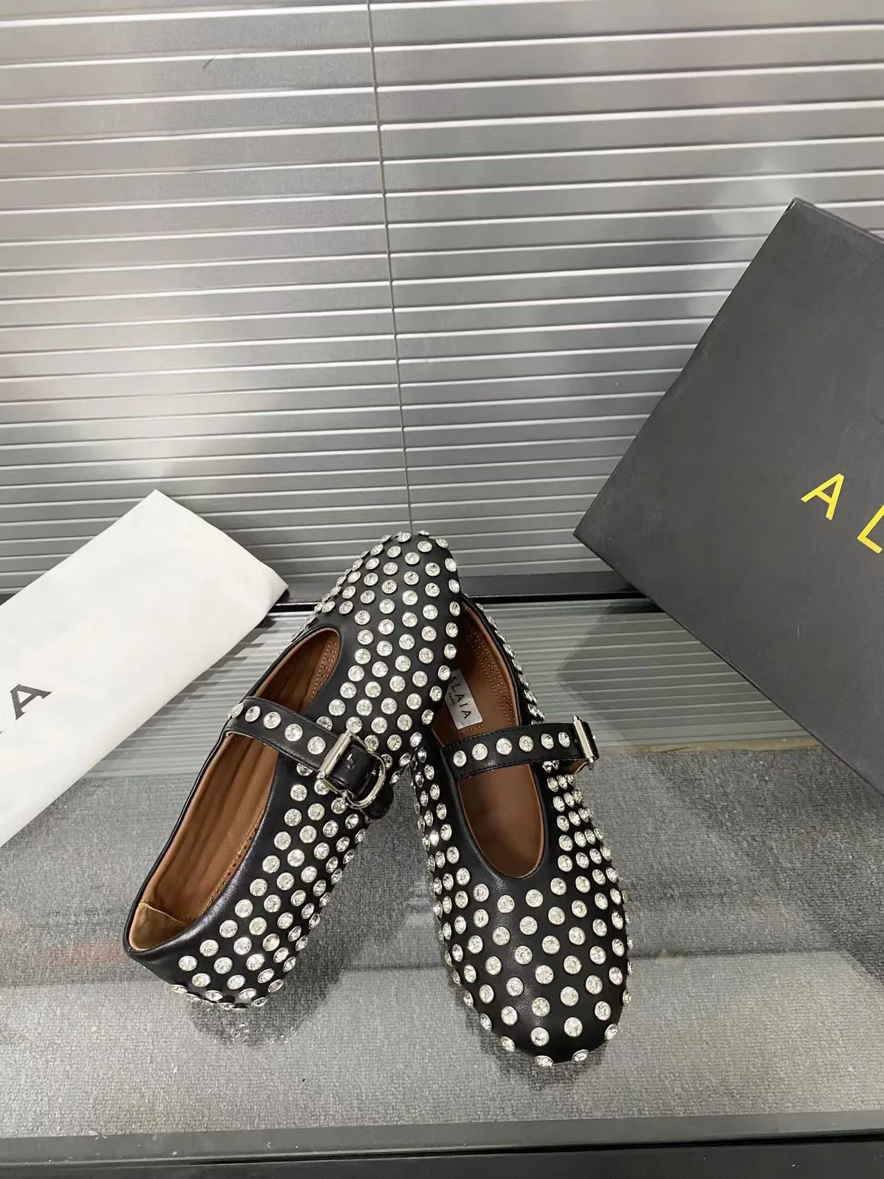 Alaia Cowhide Sheepskin Buckle Studded Mary Jane Flats in Black · view 5