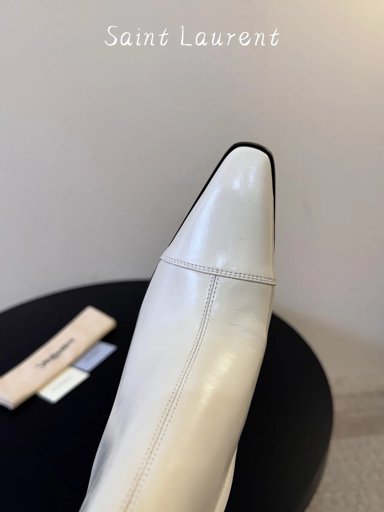 Saint Laurent Glossy Pointed-Toe Ankle Boots in White · view 6