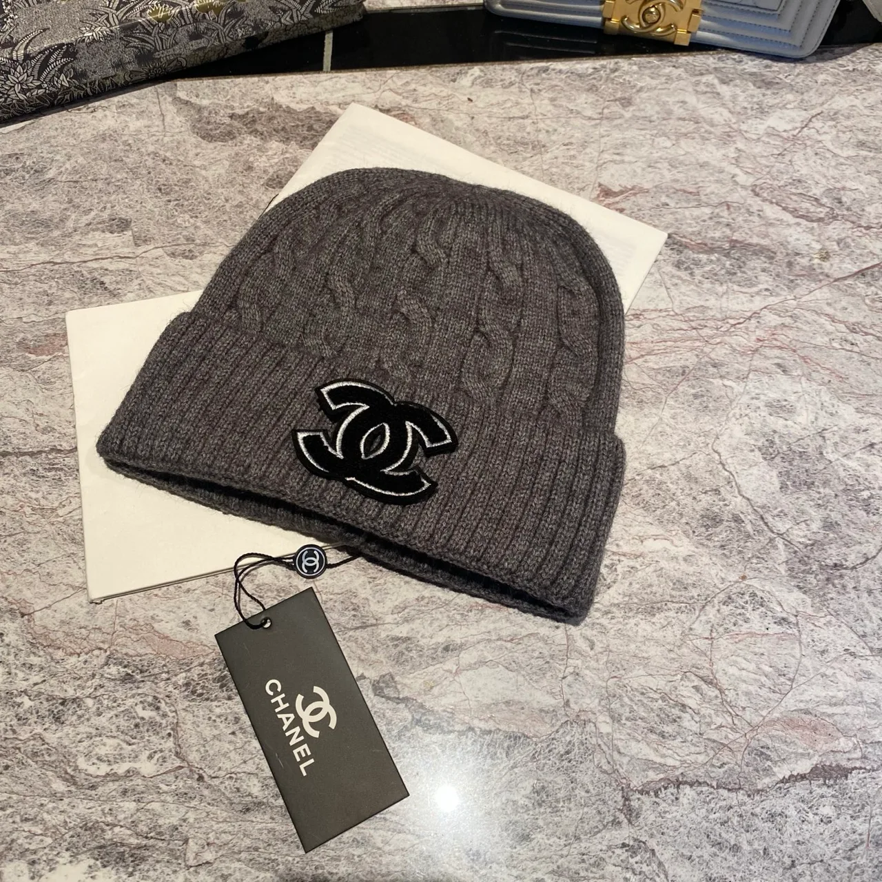 Chanel CC Cable-Knit Beanie in Brown / White / Grey / Pink / Black / Blue / Red · view 7
