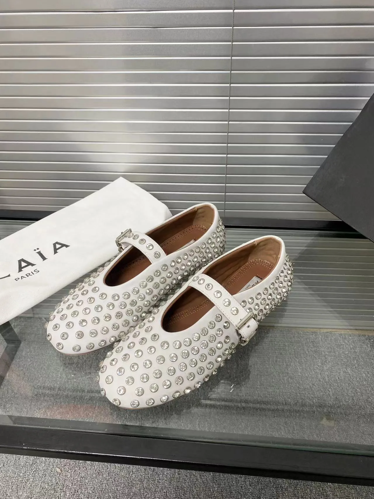 Alaia Cowhide Sheepskin Glossy Round-Toe Buckle Studded Mary Jane Flats in White · view 2