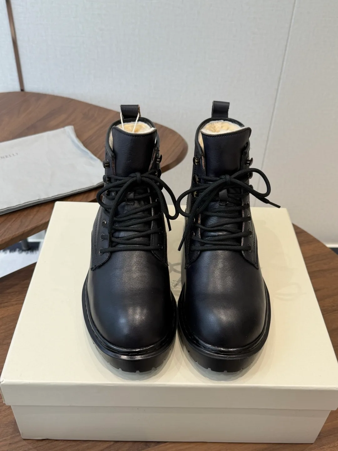 Brunello Cucinelli Cowhide Glossy Round-Toe Lace-Up Ankle Boots in Black · view 1