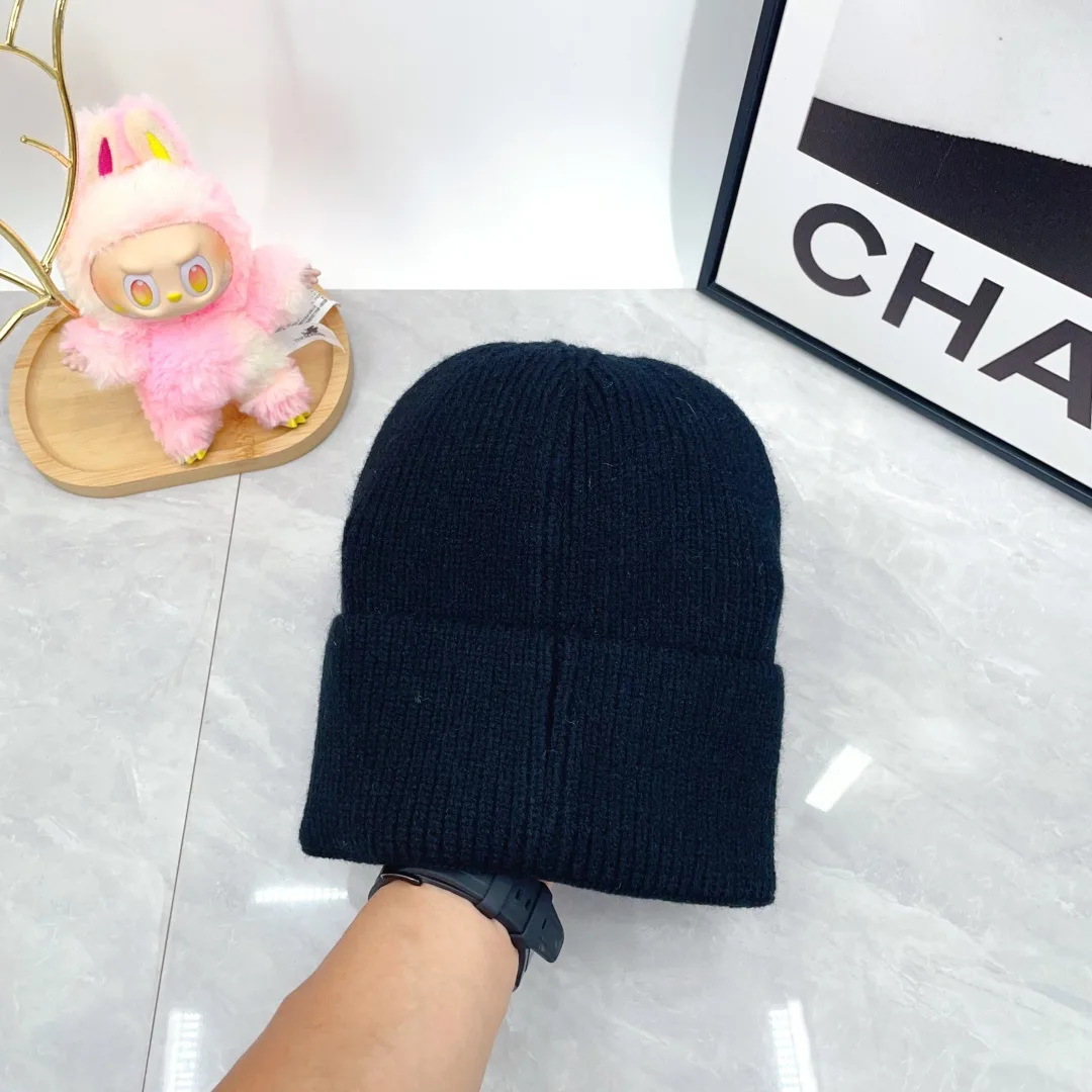 Prada Wool Triangle Logo Knit Beanie in Black · view 6