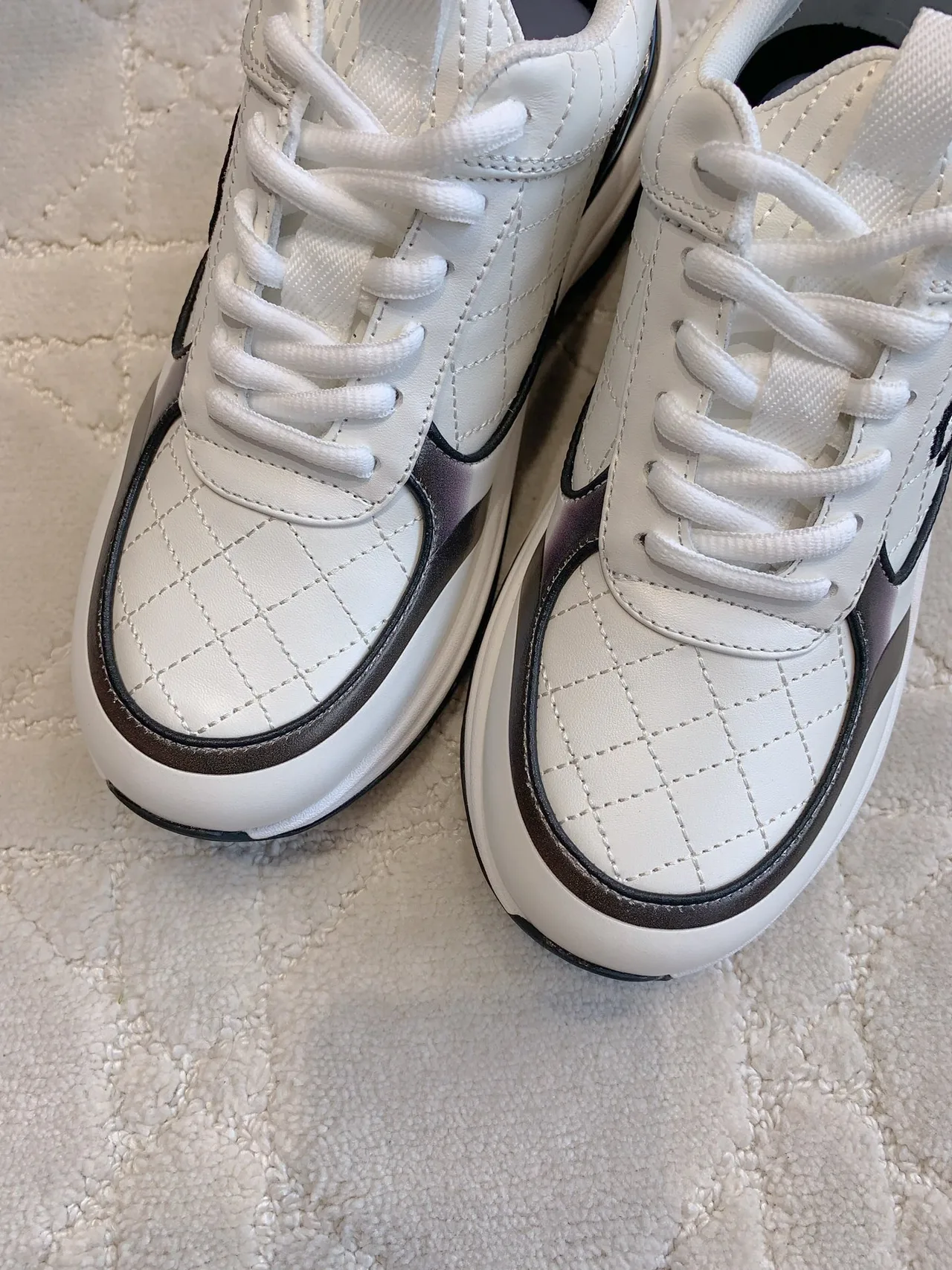 Chanel Quilted Sneakers in White · view 7