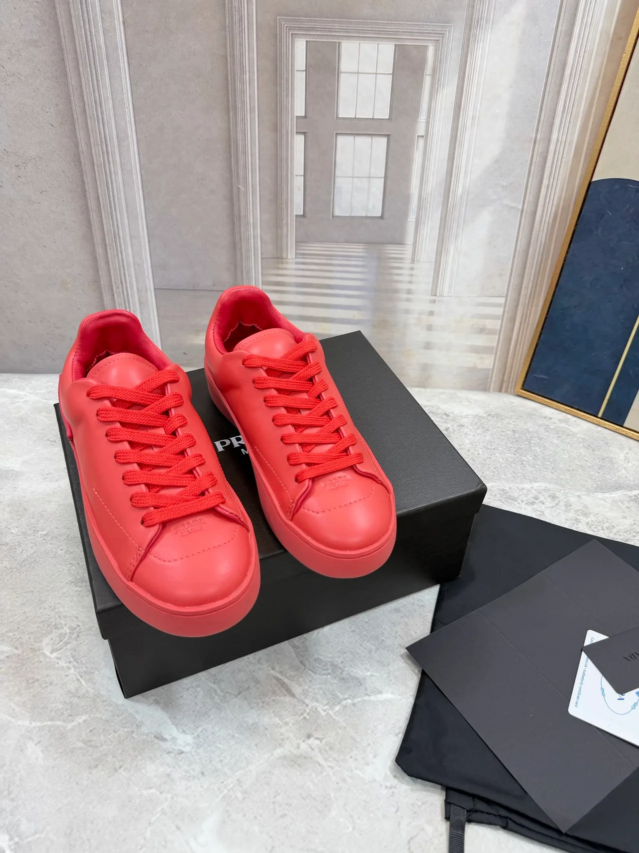 Prada Cowhide Round-Toe Low-Top Sneakers in Red · view 1