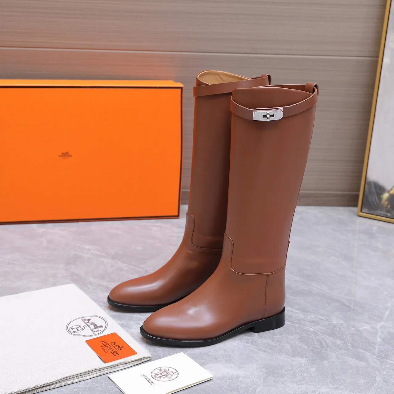 Hermes Cowhide Glossy Buckle Knee-High Boots in Brown · view 1
