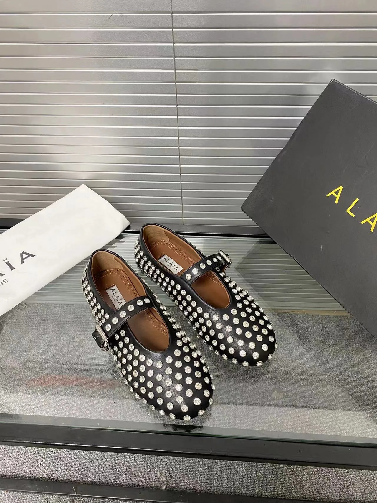 Alaia Cowhide Sheepskin Buckle Studded Mary Jane Flats in Black · view 2