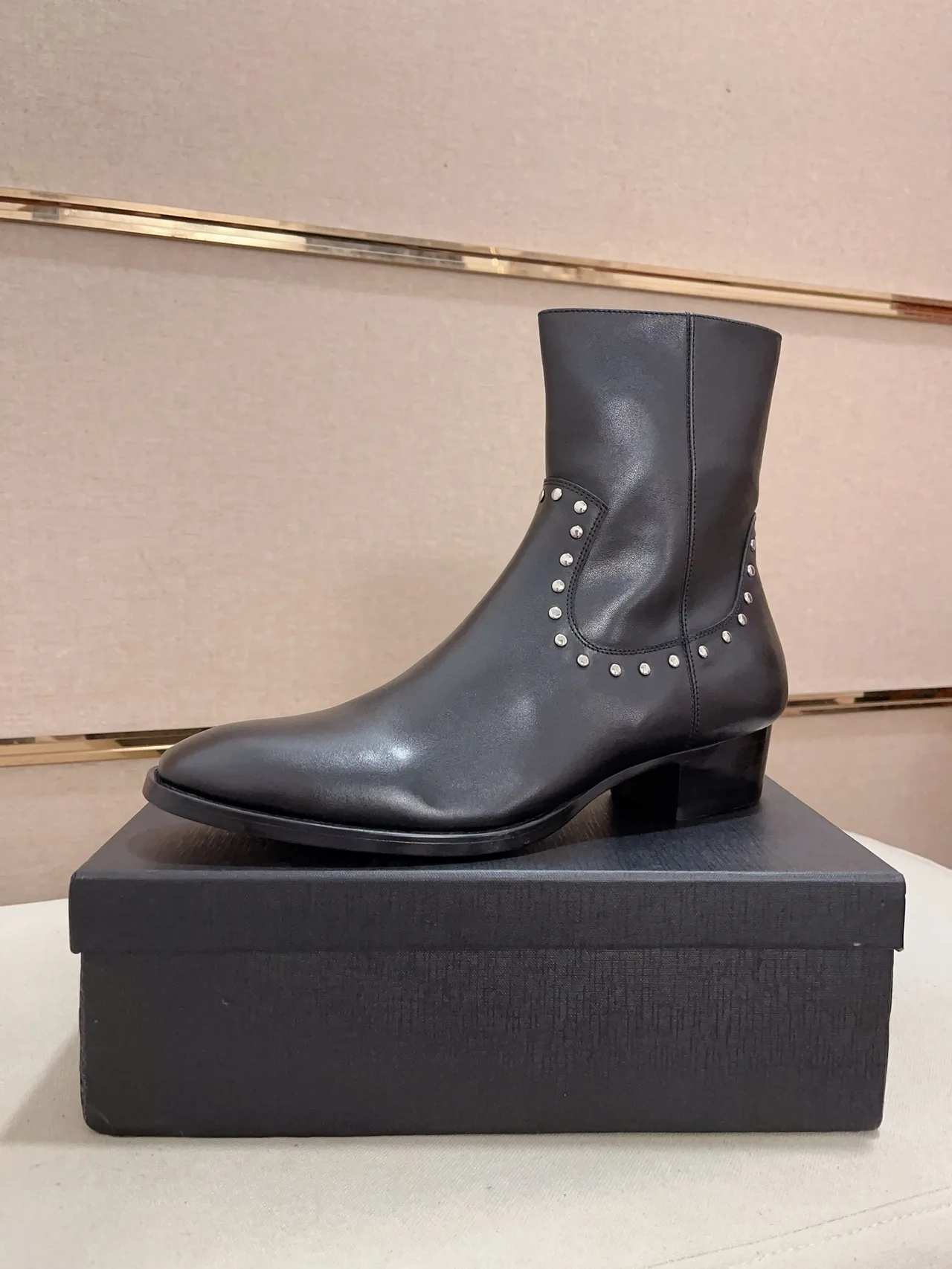 Saint Laurent Cowhide Glossy Pointed-Toe Ankle Boots in Black · view 1