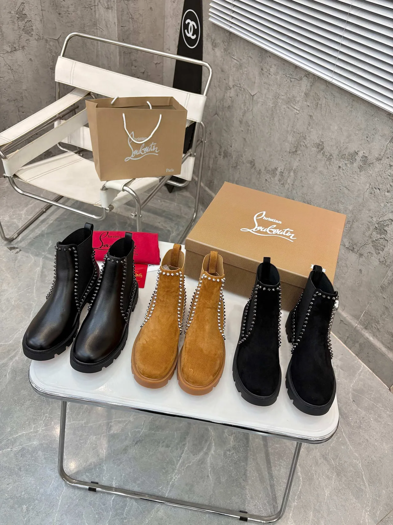 Christian Louboutin Stud-trim ankle boots in Black & Tan · view 1