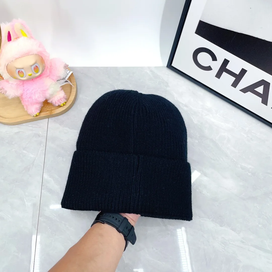 Prada Triangle-Badge Beanie in Black & Grey & White & Beige & Brown & Yellow & Blue & Pink & Red · view 10