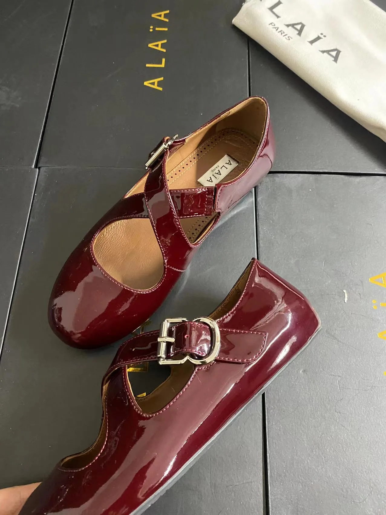 Alaia Cowhide Sheepskin Glossy Square-Toe Buckle Cross-Strap Mary Jane Flats in Burgundy · view 3