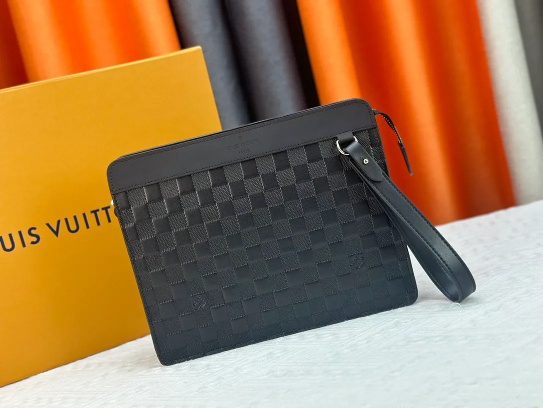 Louis Vuitton Canvas Woven Clutch in Black · view 1