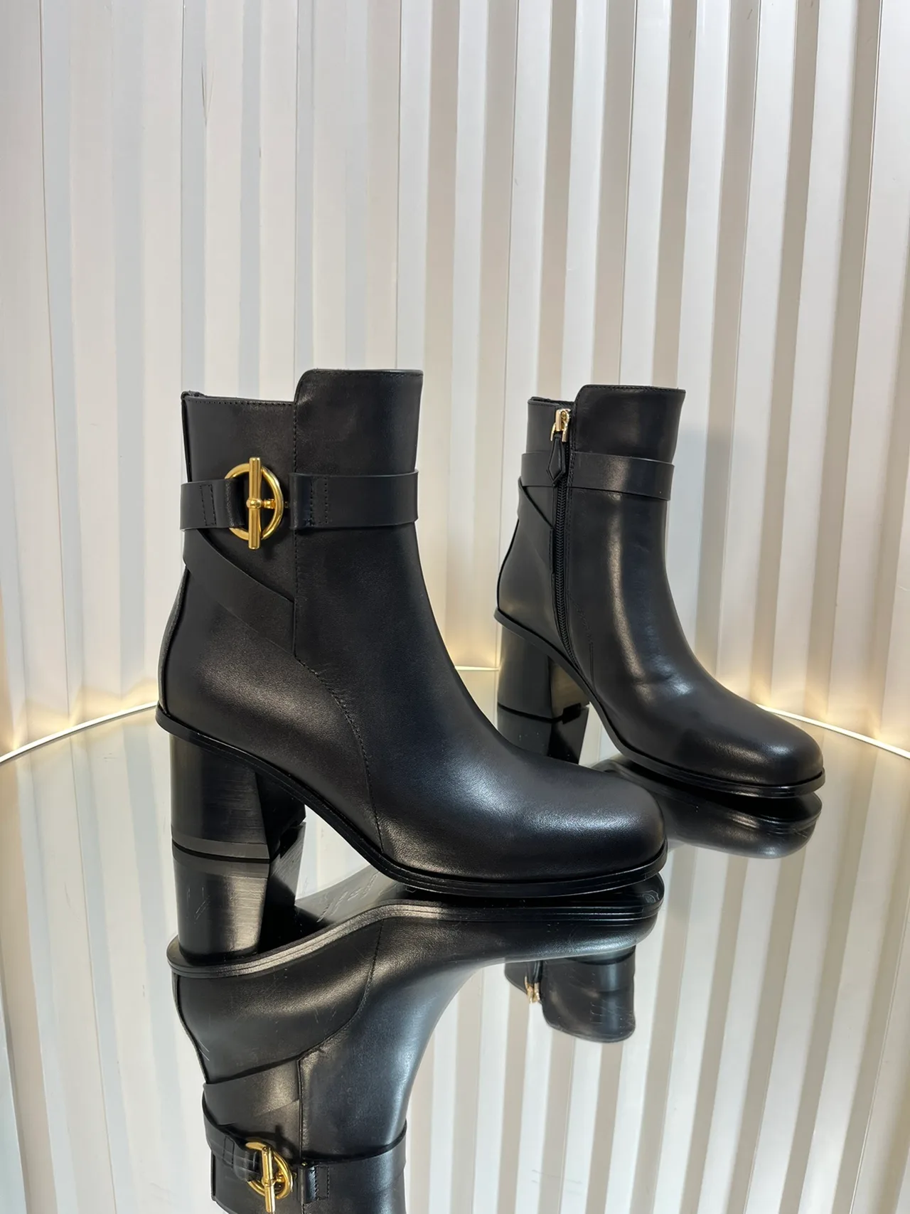 Calfskin Glossy D-Buckle Smooth Ankle Boots in Black · view 1