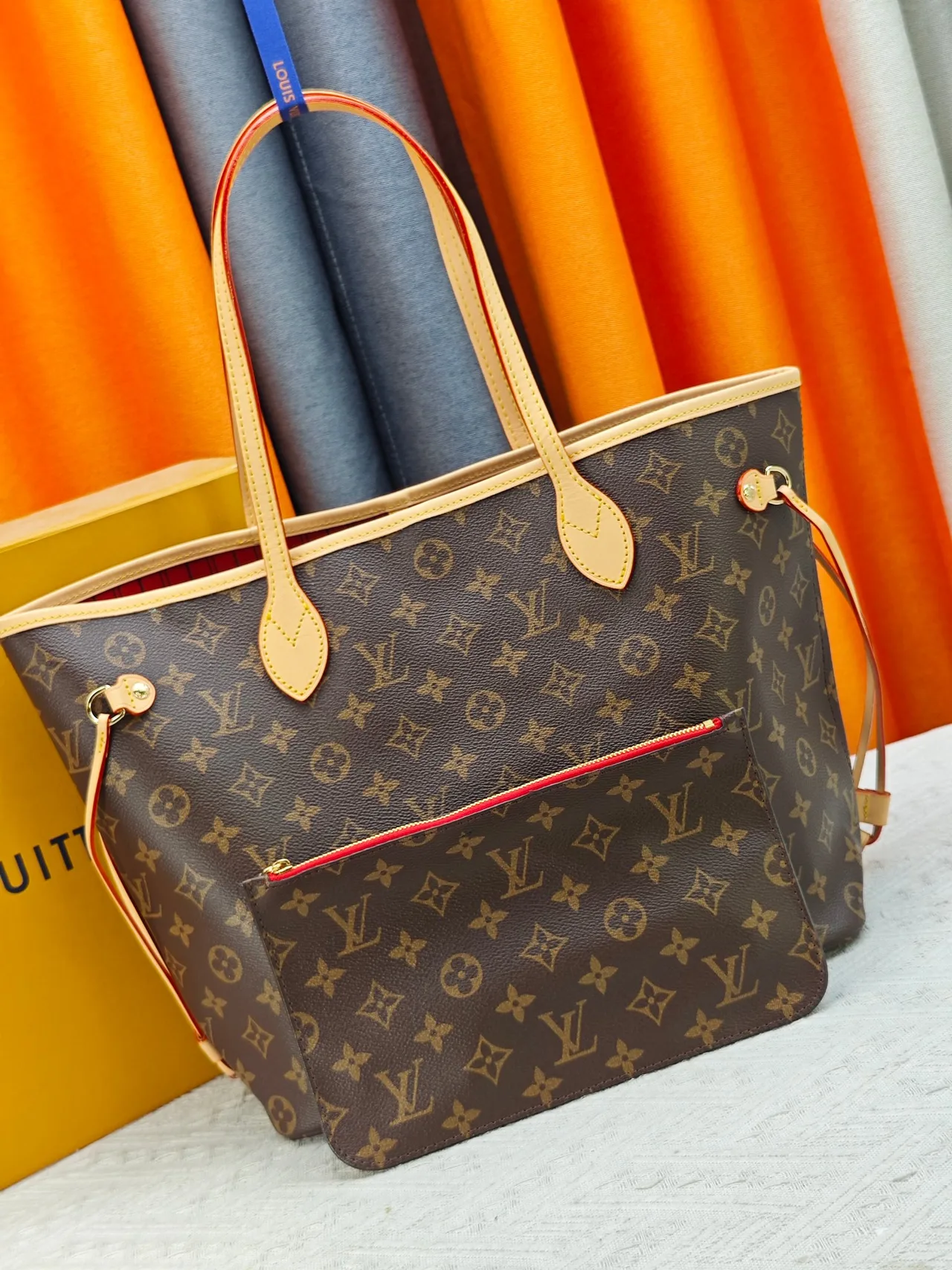 Louis Vuitton Neverfull Clutch in Brown · view 1