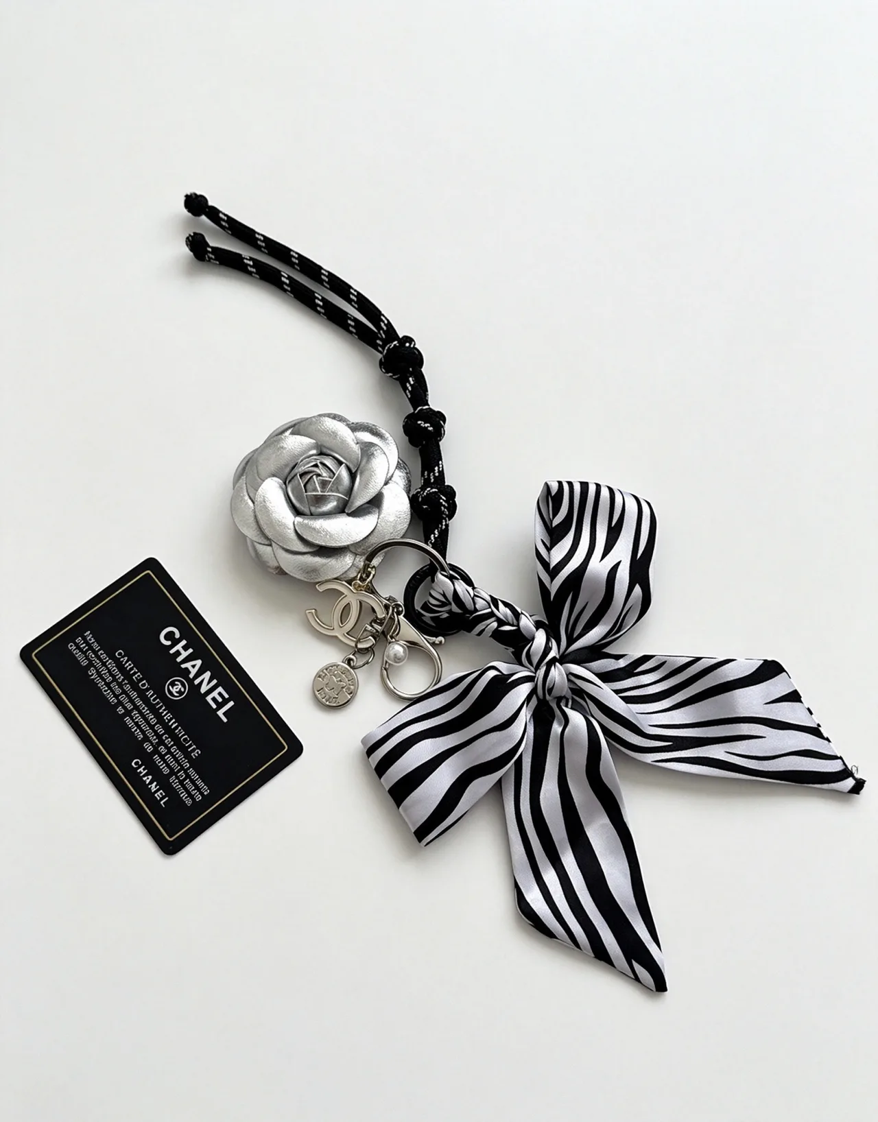 Chanel Striped Camellia Keychain in Silver · view 1