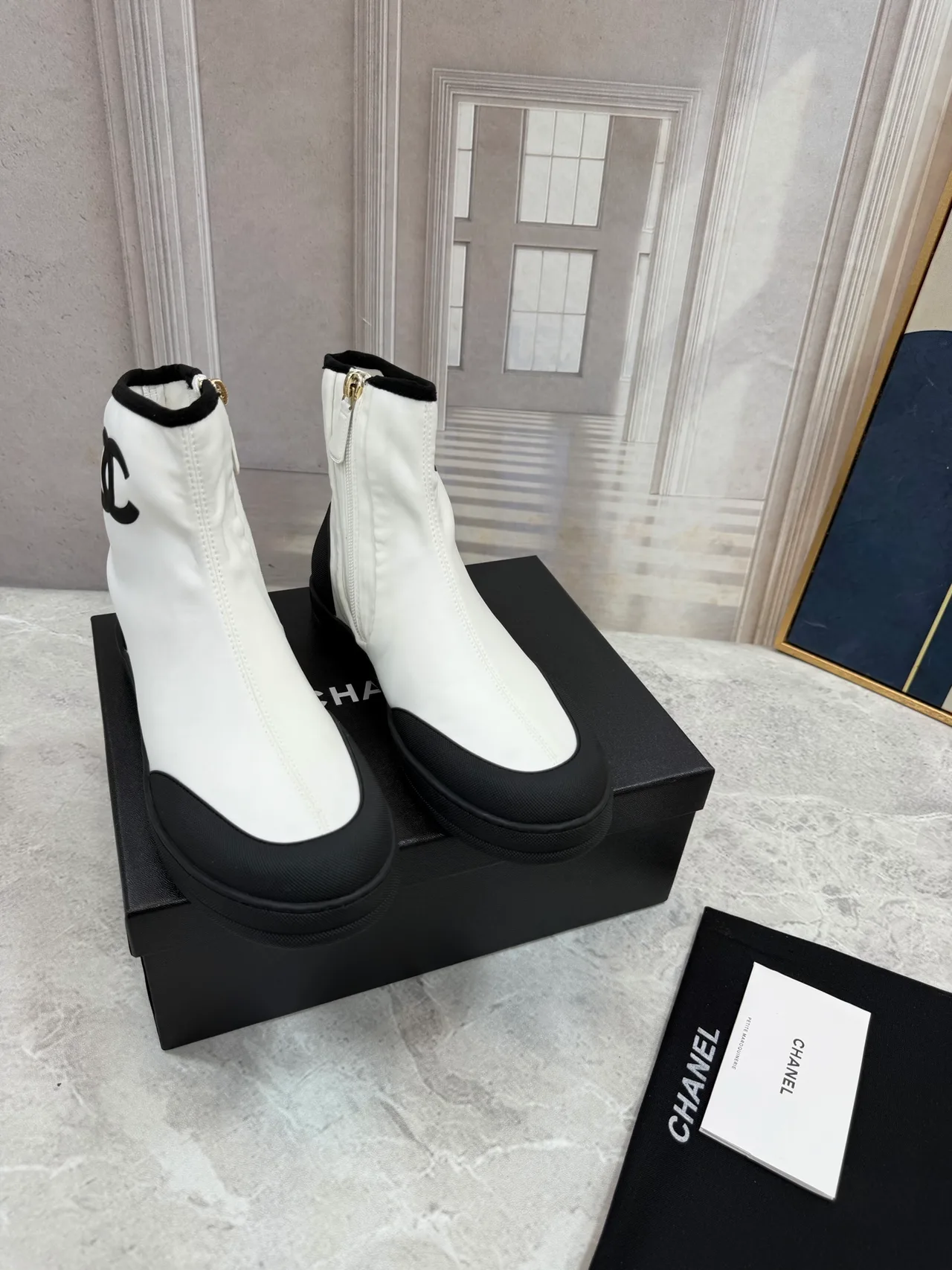 Chanel Cowhide Quilted Glossy Ankle Boots in White · view 1