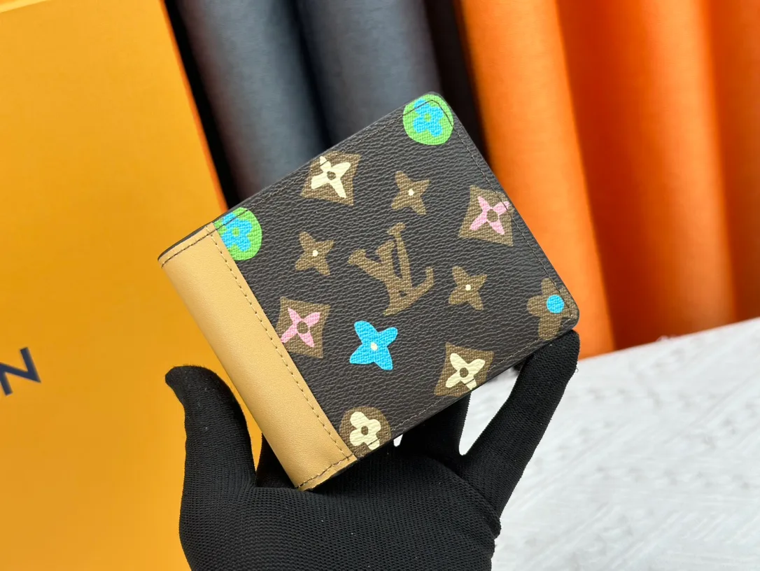 Louis Vuitton Canvas Wallet in Brown · view 1