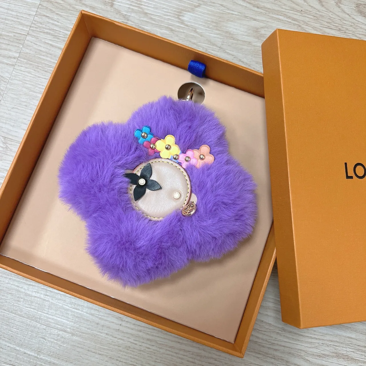 Louis Vuitton Faux-fur flower bag charm in Purple & White & Brown & Yellow & Red & Pink & Black & Blue & Cream · view 1