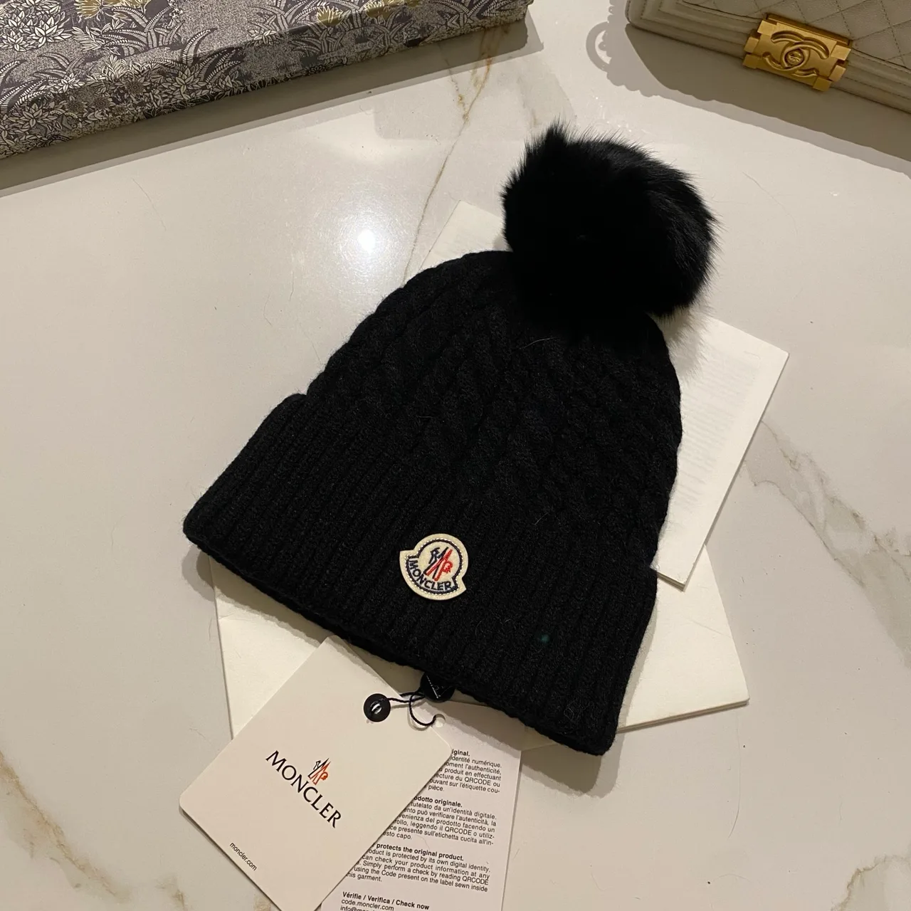 Moncler Pom-Pom Beanie in Black & White & Cream & Tan & Grey & Burgundy & Brown · view 1