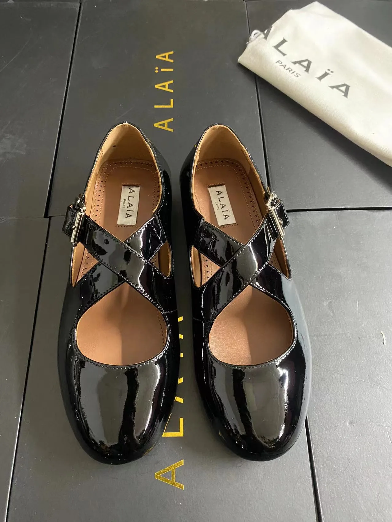 Alaia Cowhide Sheepskin Glossy Square-Toe Mary Jane Flats in Black · view 1