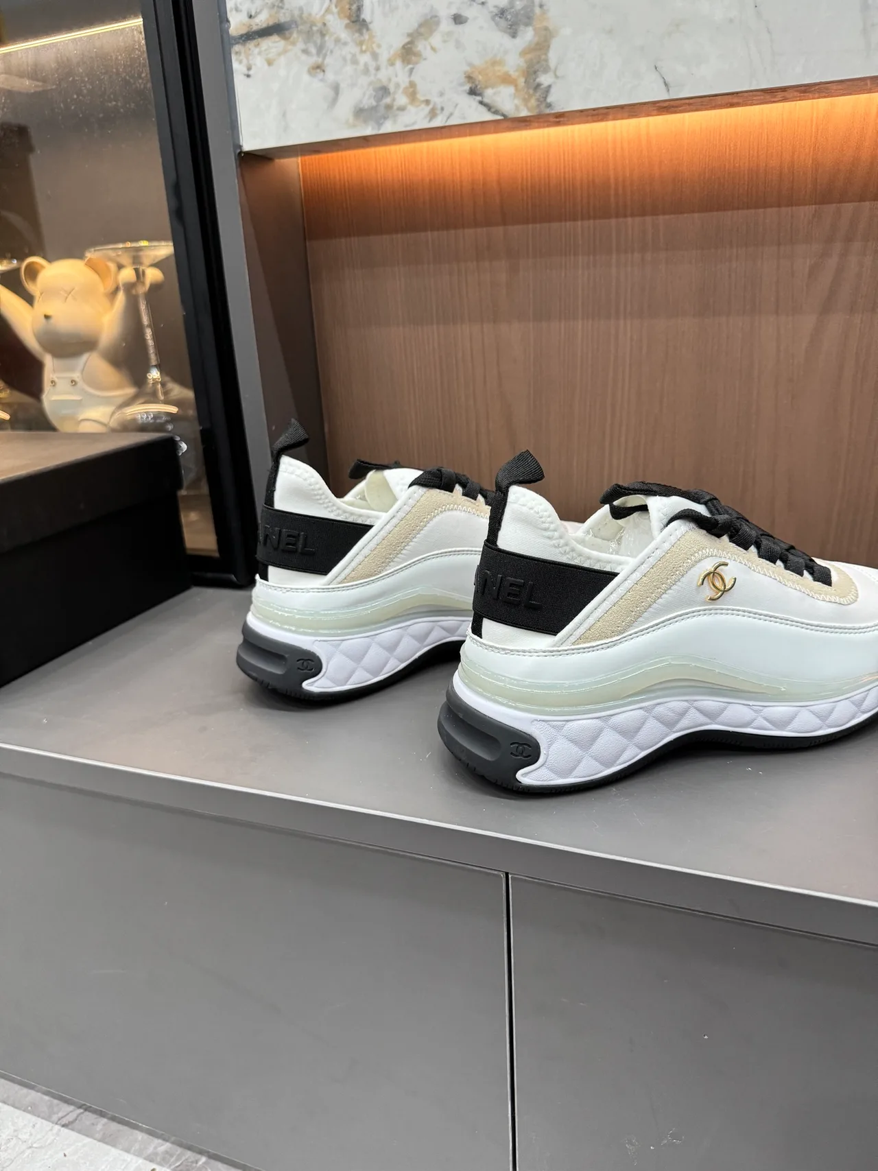 Chanel Cowhide Quilted Lace-Up Sneakers in White · view 7