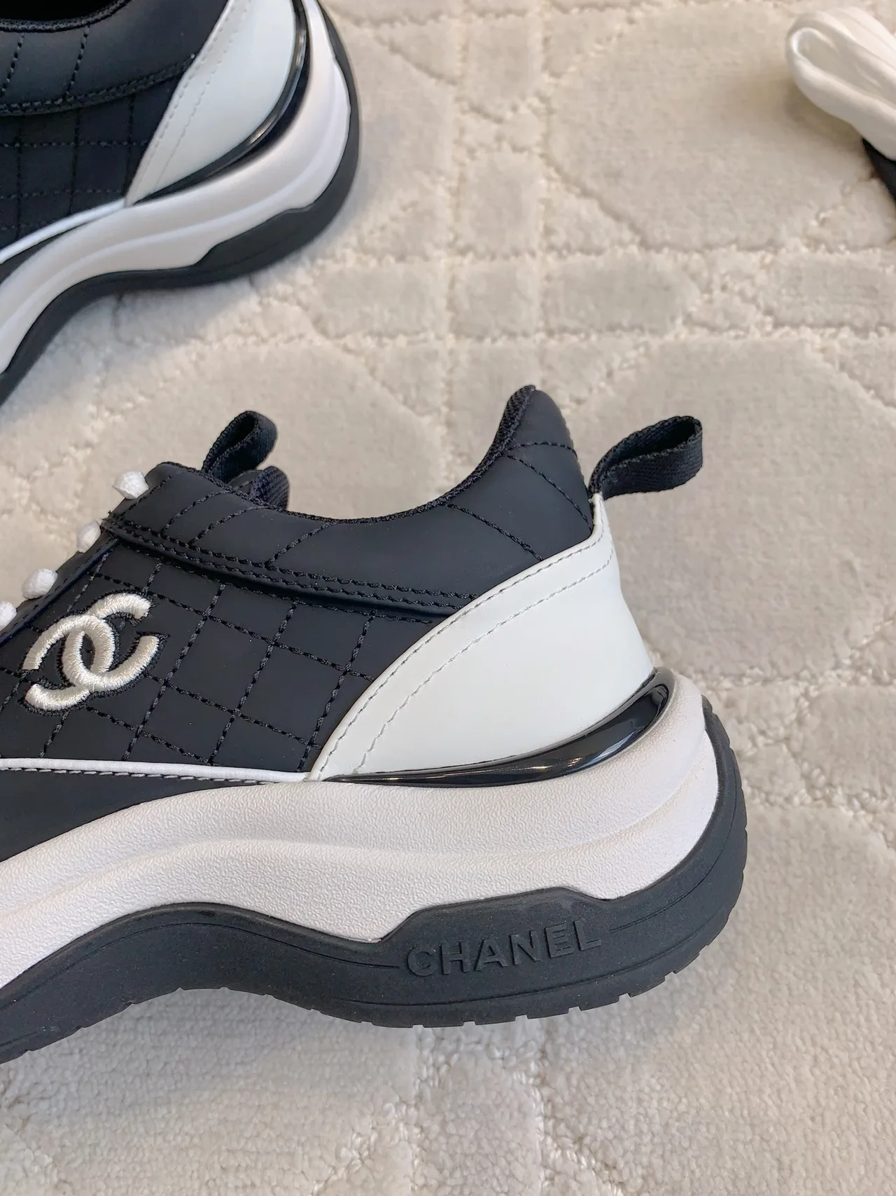 Chanel Quilted Sneakers in Black · view 7