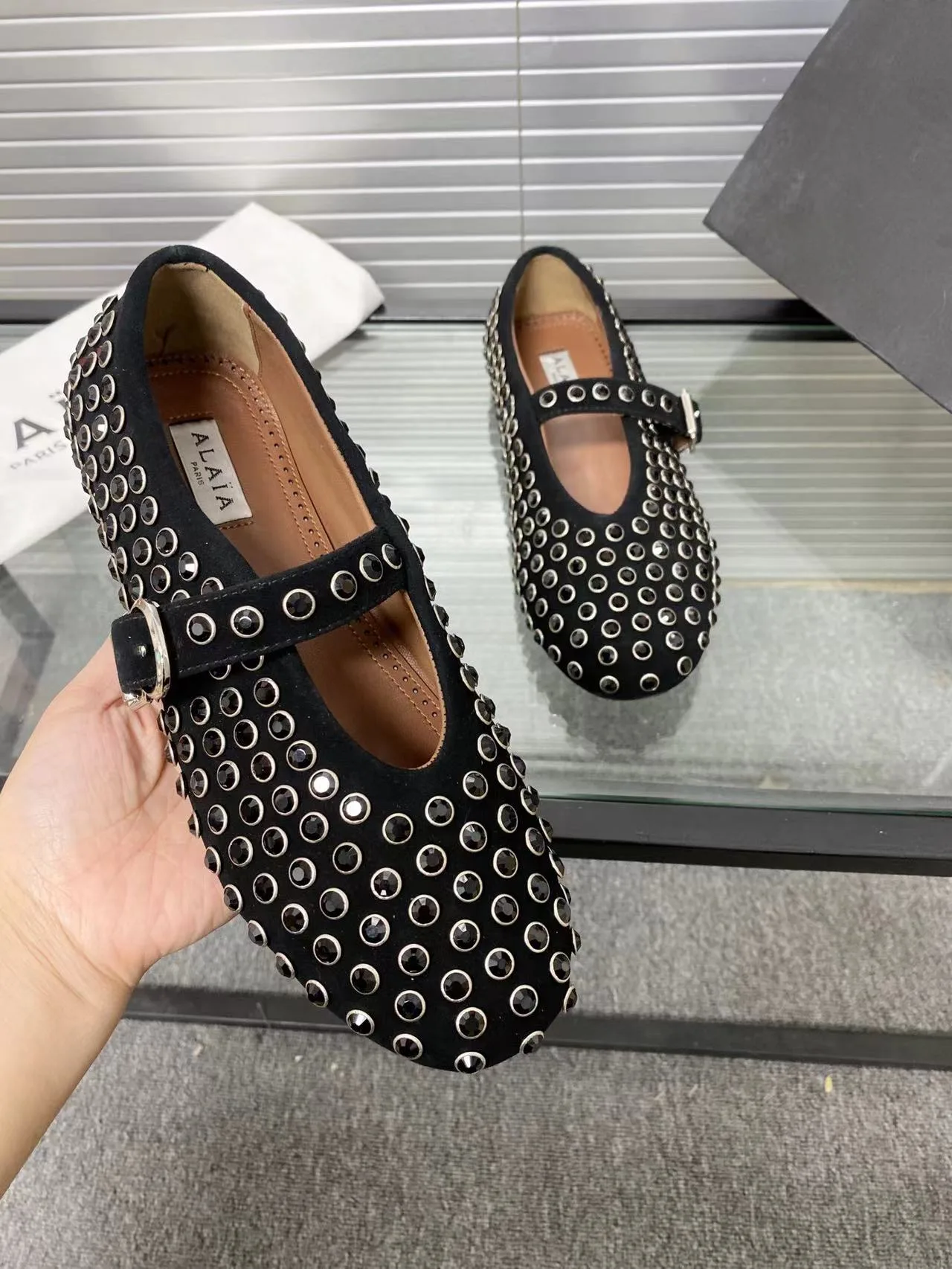 Alaia Cowhide Sheepskin Round-Toe Studded Mary Jane Flats in Black · view 8