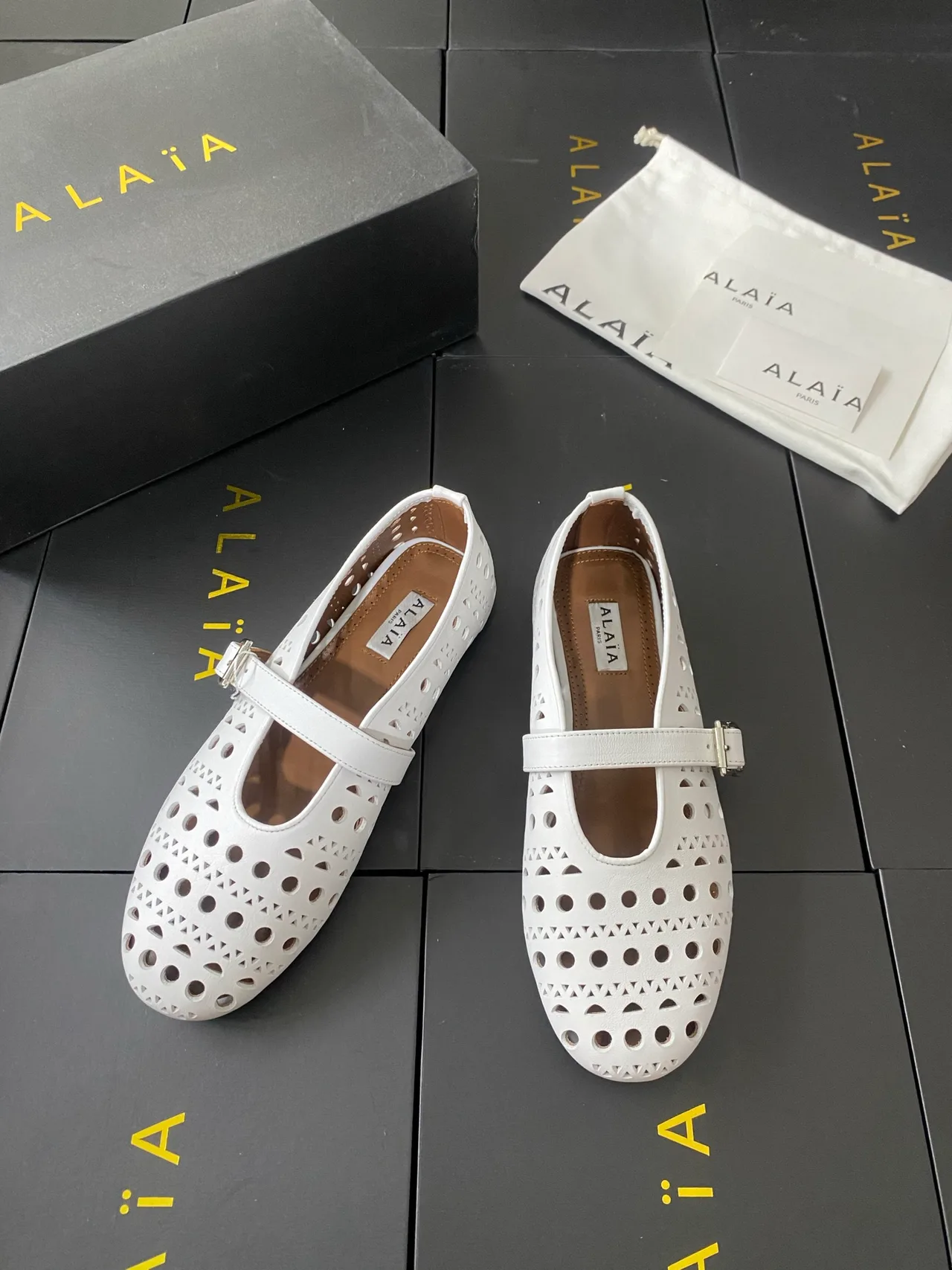 Alaia Cowhide Sheepskin Round-Toe Buckle Ballet Flats in White · view 2