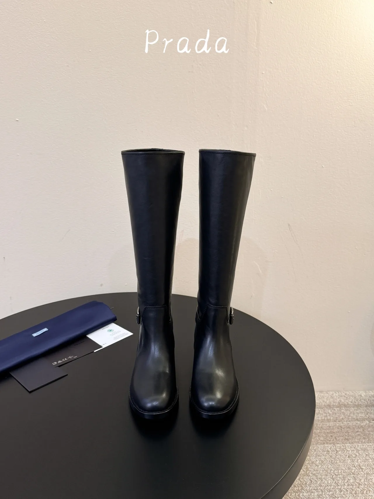 Prada Cowhide Glossy Pointed-Toe Knee-High Boots in Black · view 1