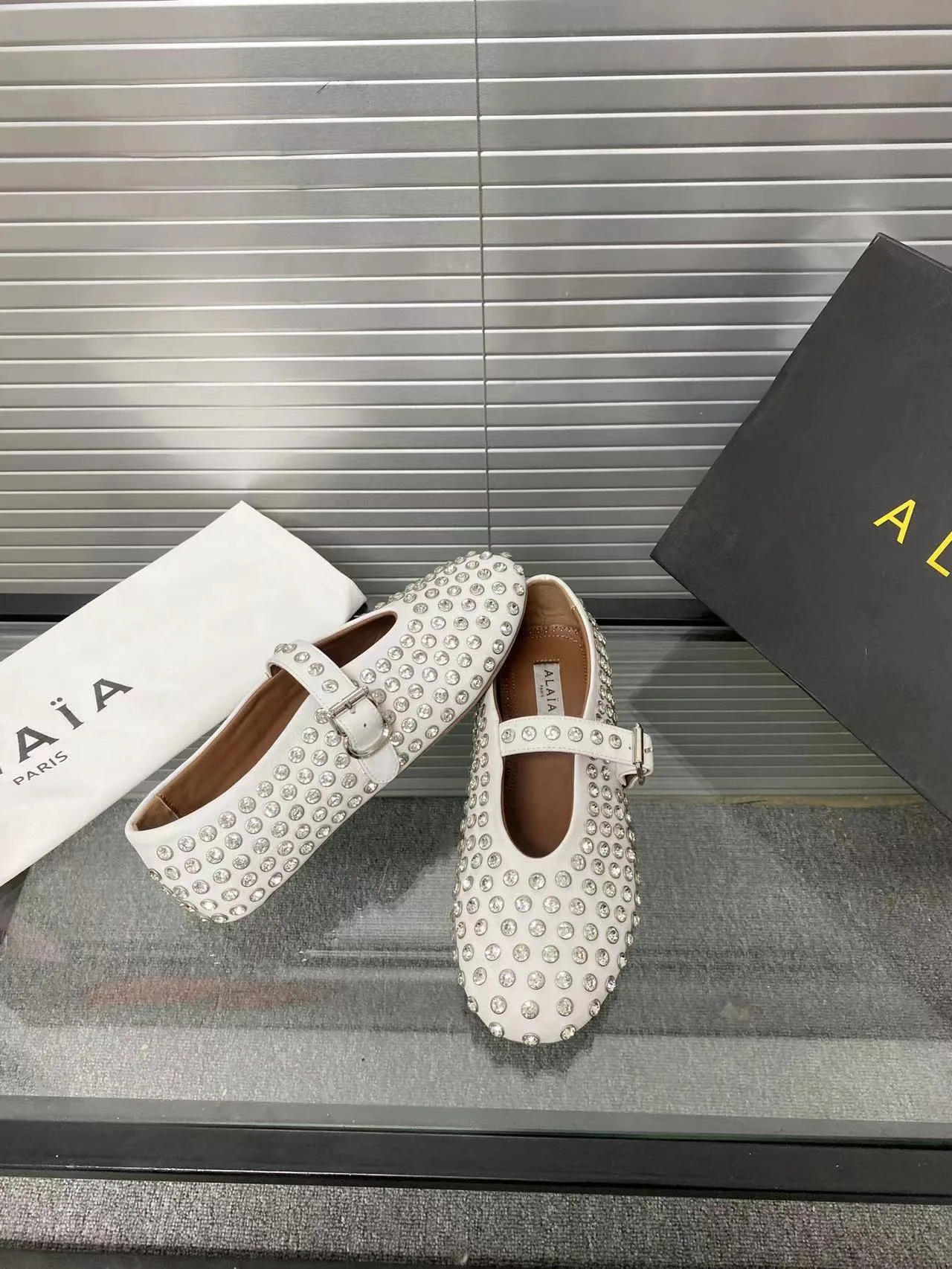 Alaia Cowhide Sheepskin Glossy Round-Toe Buckle Studded Mary Jane Flats in White · view 4
