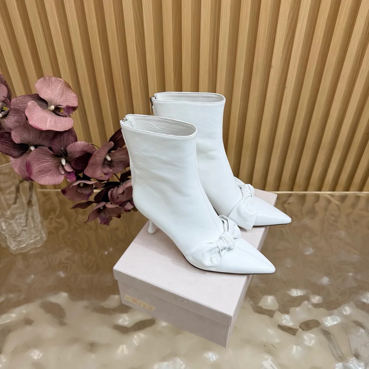 Jimmy Choo Cowhide Glossy Pointed-Toe Bow Ankle Boots in White · view 2