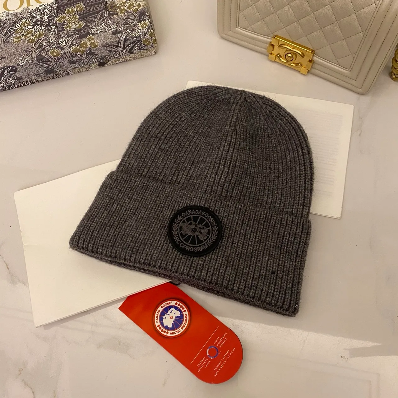 Canada Goose Logo knit beanie in Red & Blue & Yellow & Orange & Pink & Grey & White & Black & Tan & Cream · view 6