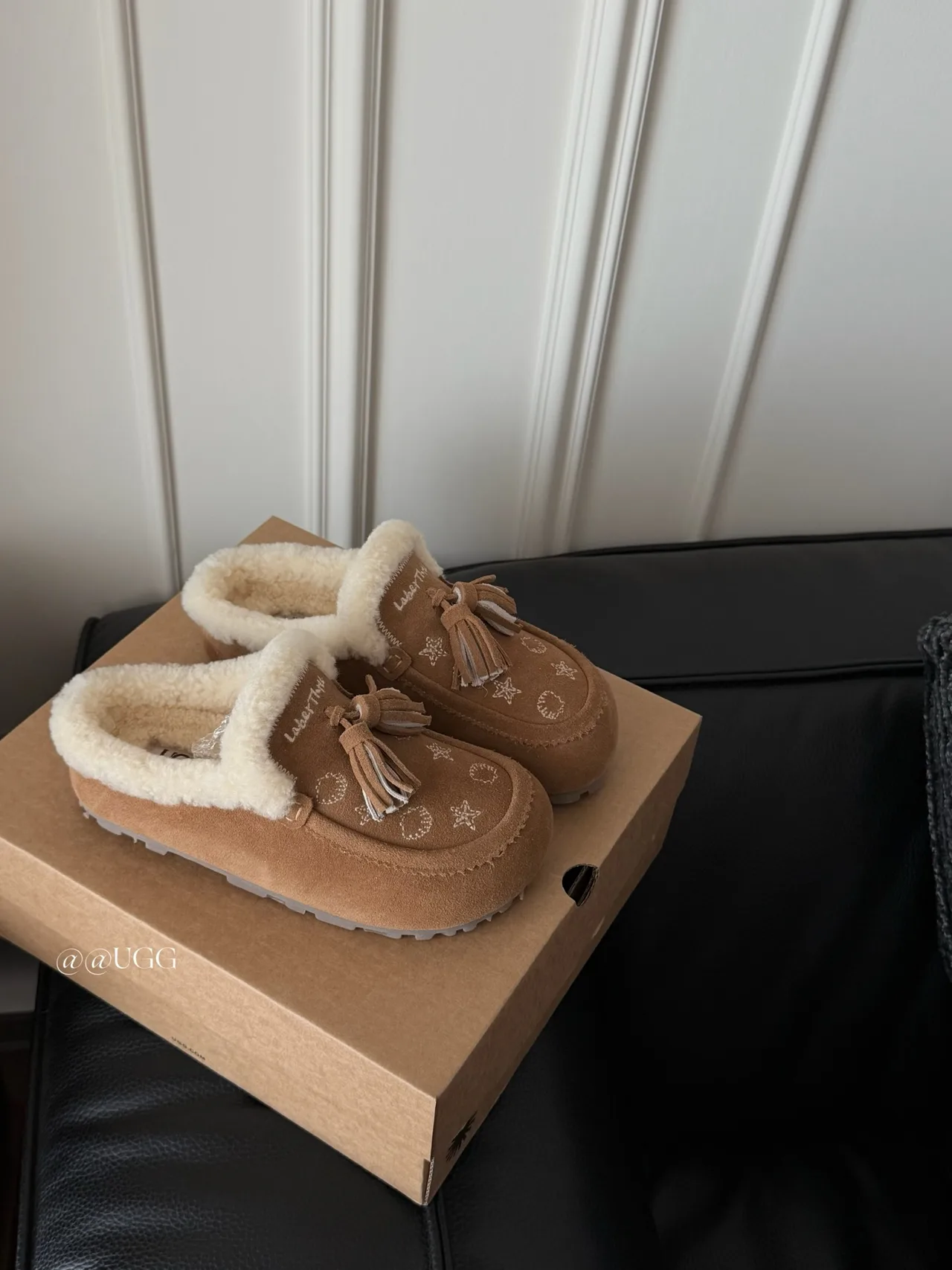 UGG Cowhide Smooth Tassel Slippers in Tan · view 1