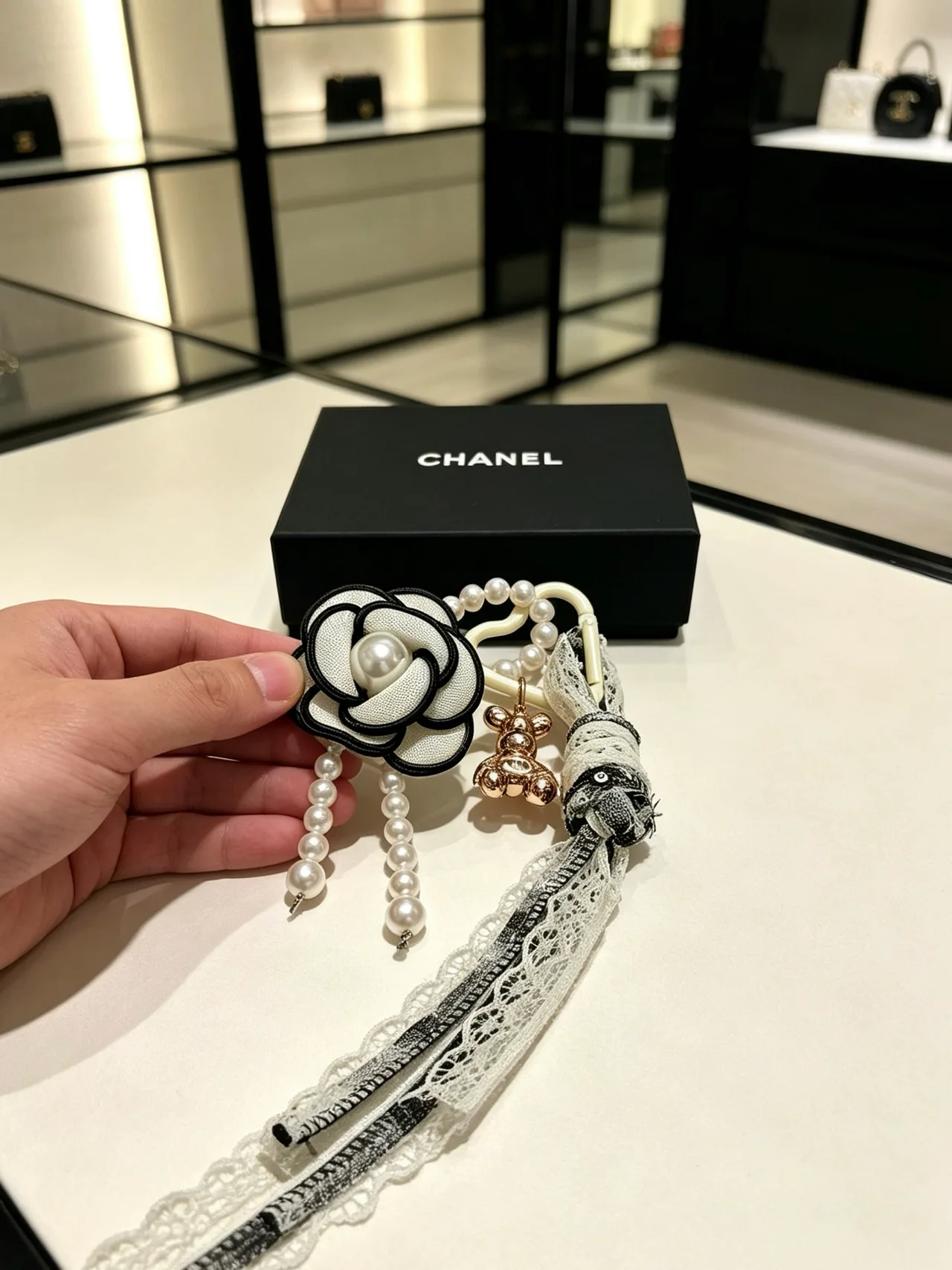 Chanel Glossy Camellia Key Charm in White · view 6