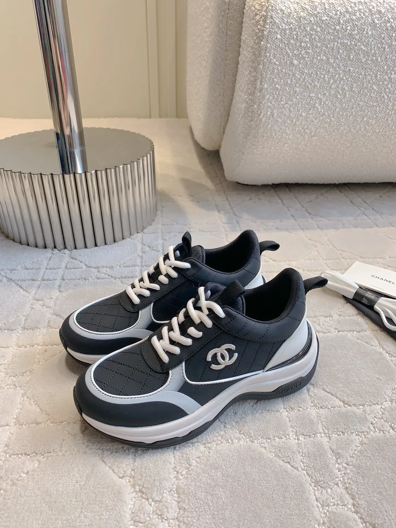 Chanel Quilted Sneakers in Black · view 2