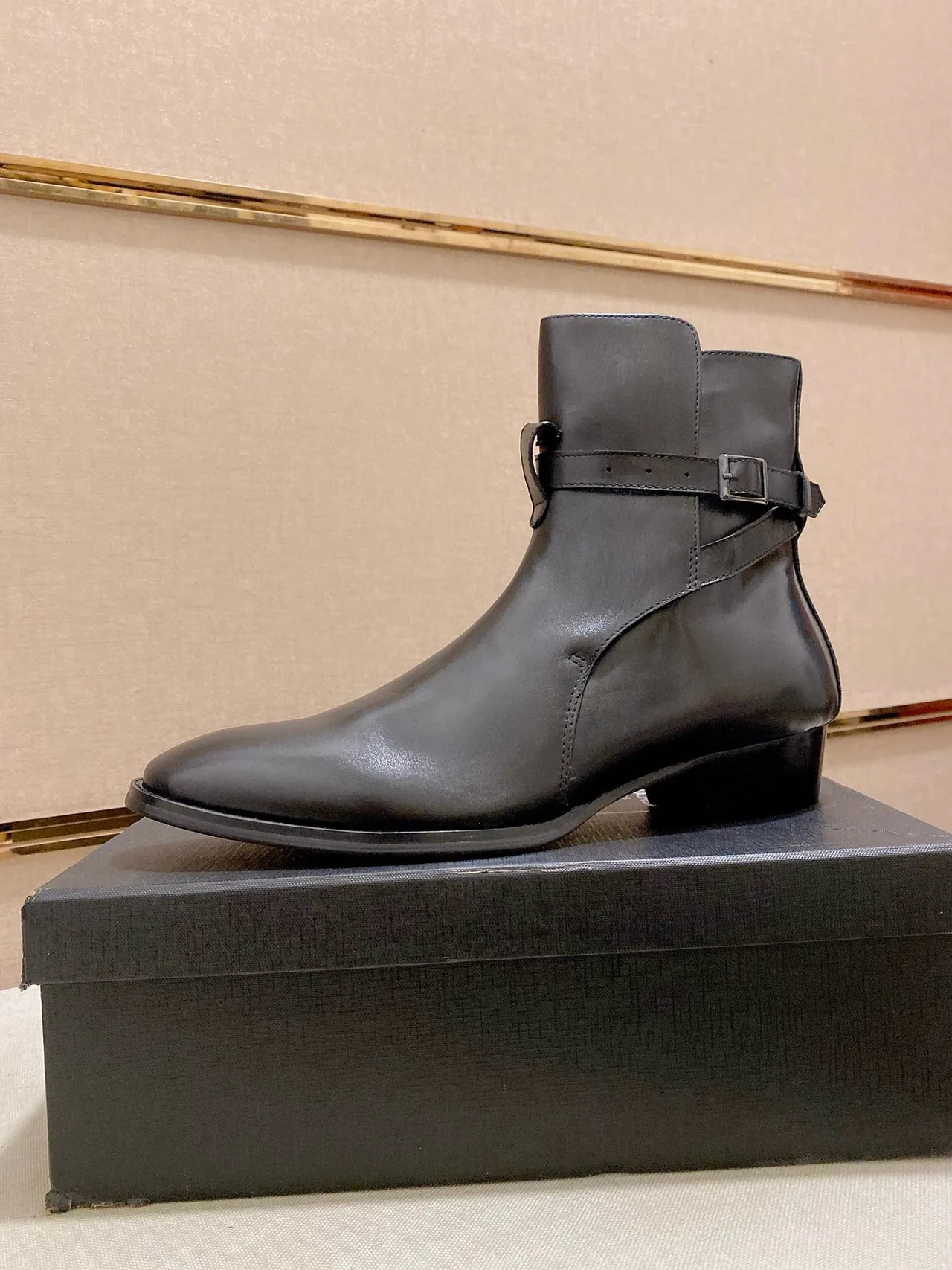 Saint Laurent Cowhide Glossy Pointed-Toe Buckle Ankle Boots in Black · view 1