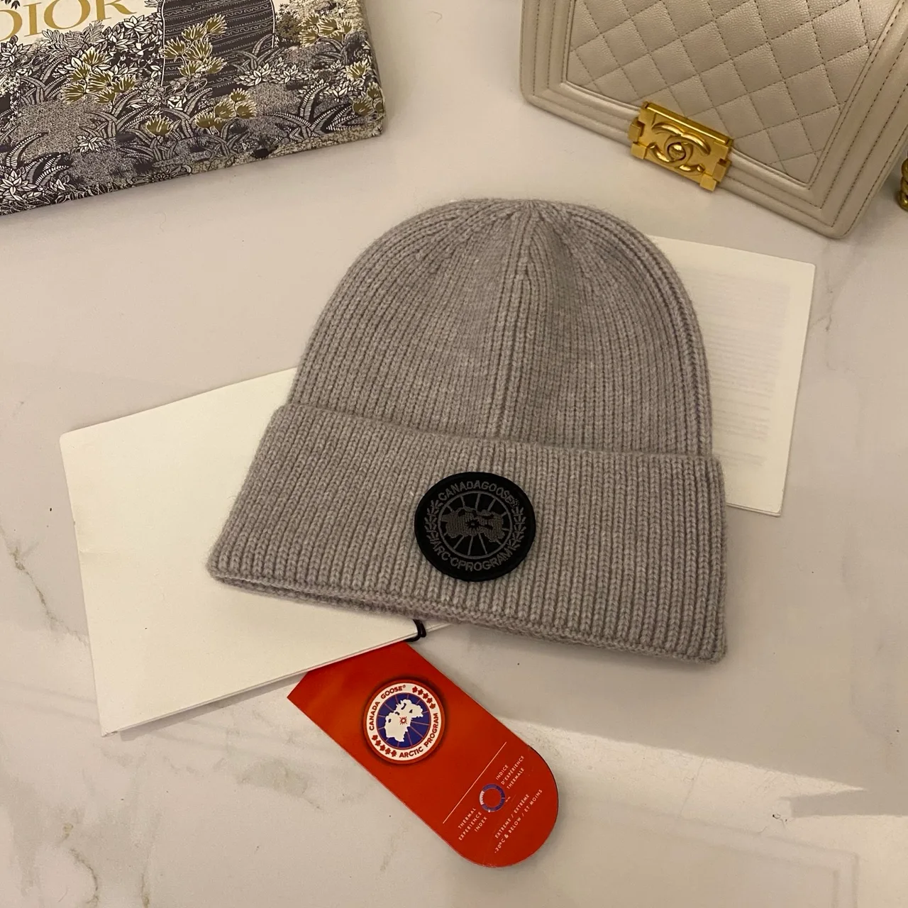 Canada Goose Logo knit beanie in Red & Blue & Yellow & Orange & Pink & Grey & White & Black & Tan & Cream · view 7