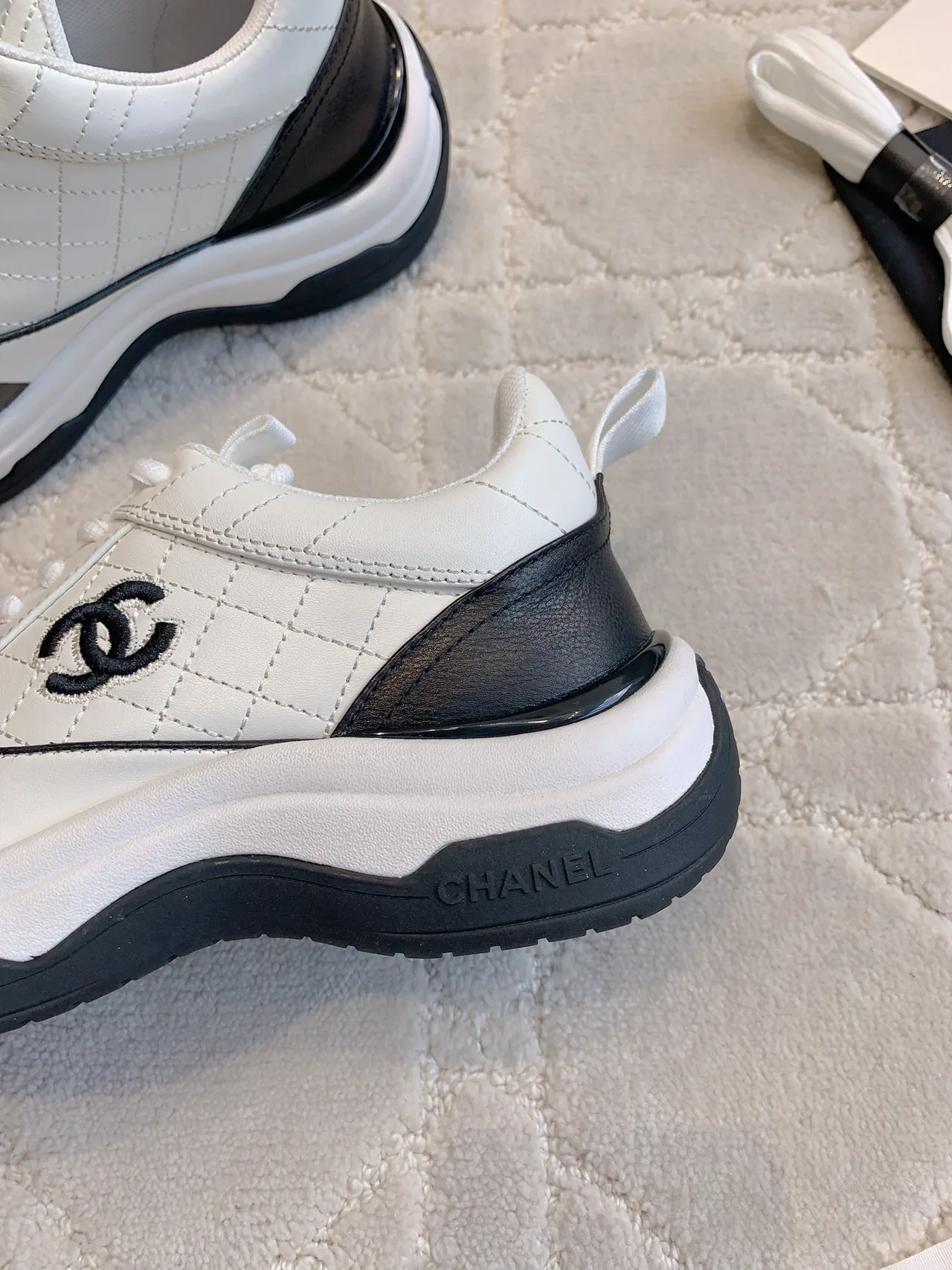 Chanel Quilted Sneakers in White · view 6