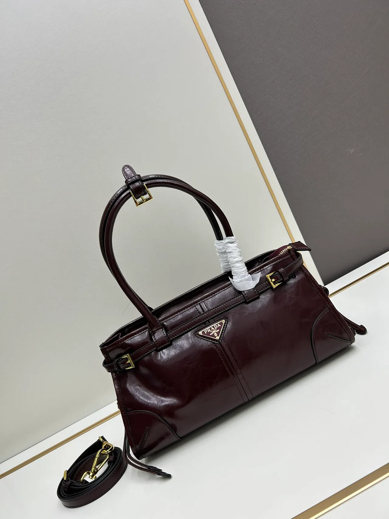 Prada Glossy Top-Handle Bag in Burgundy · view 1