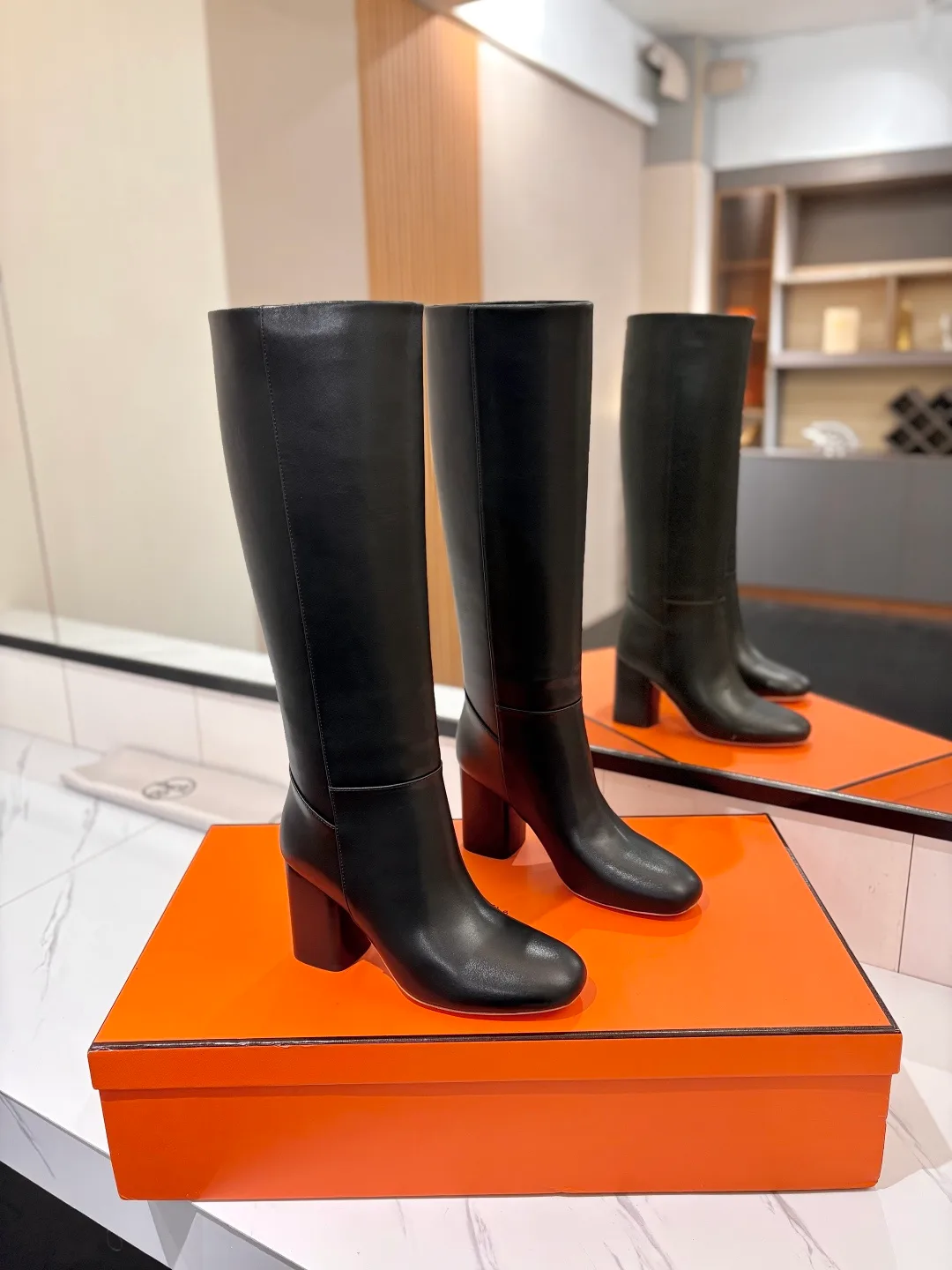 Hermes Cowhide Knee-High Boots in Black · view 1