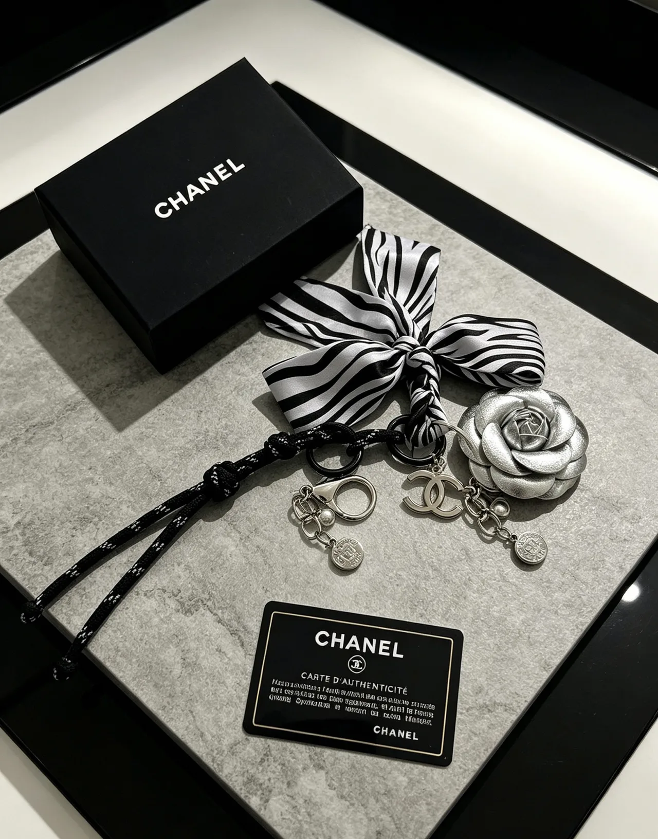 Chanel Striped Camellia Keychain in Silver · view 5